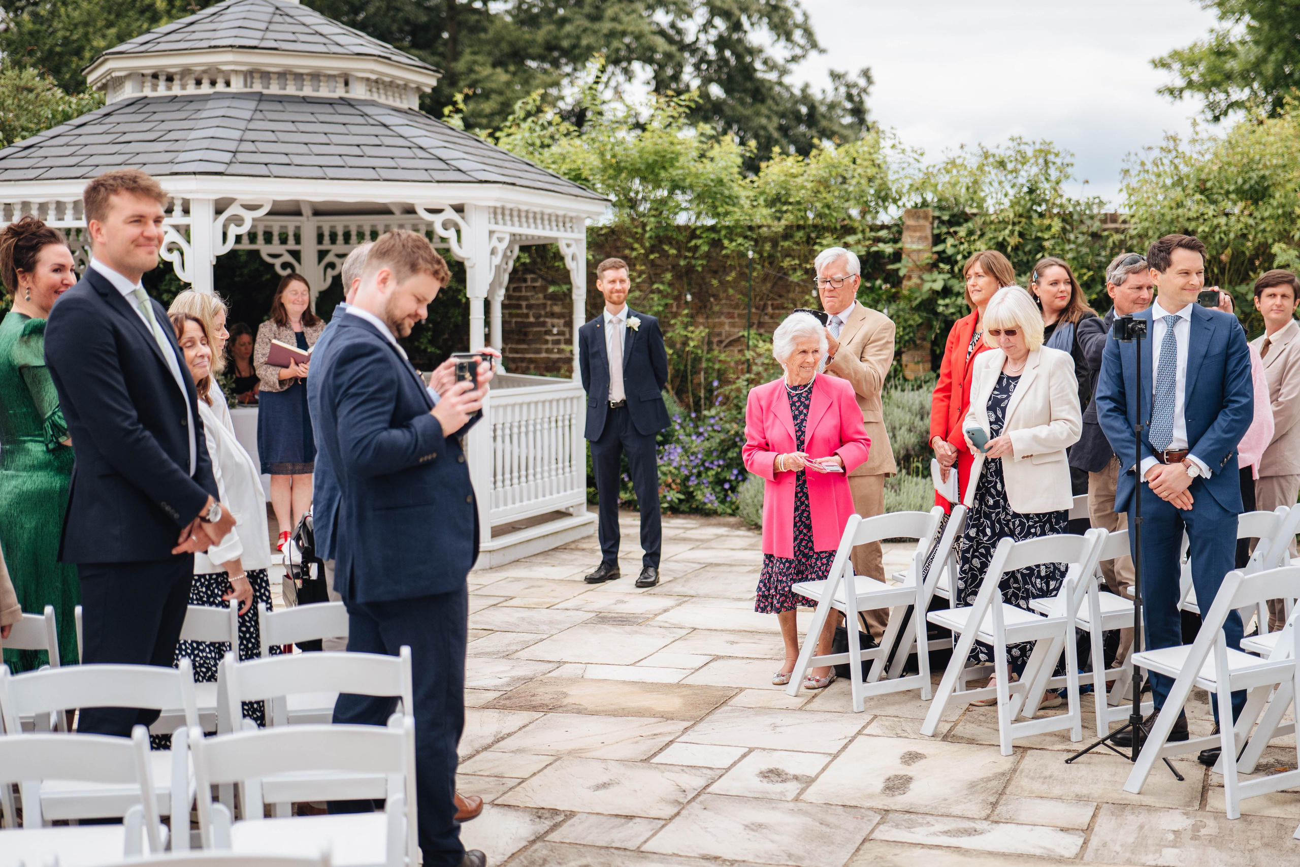 Guests meeting bride and her father at the venue