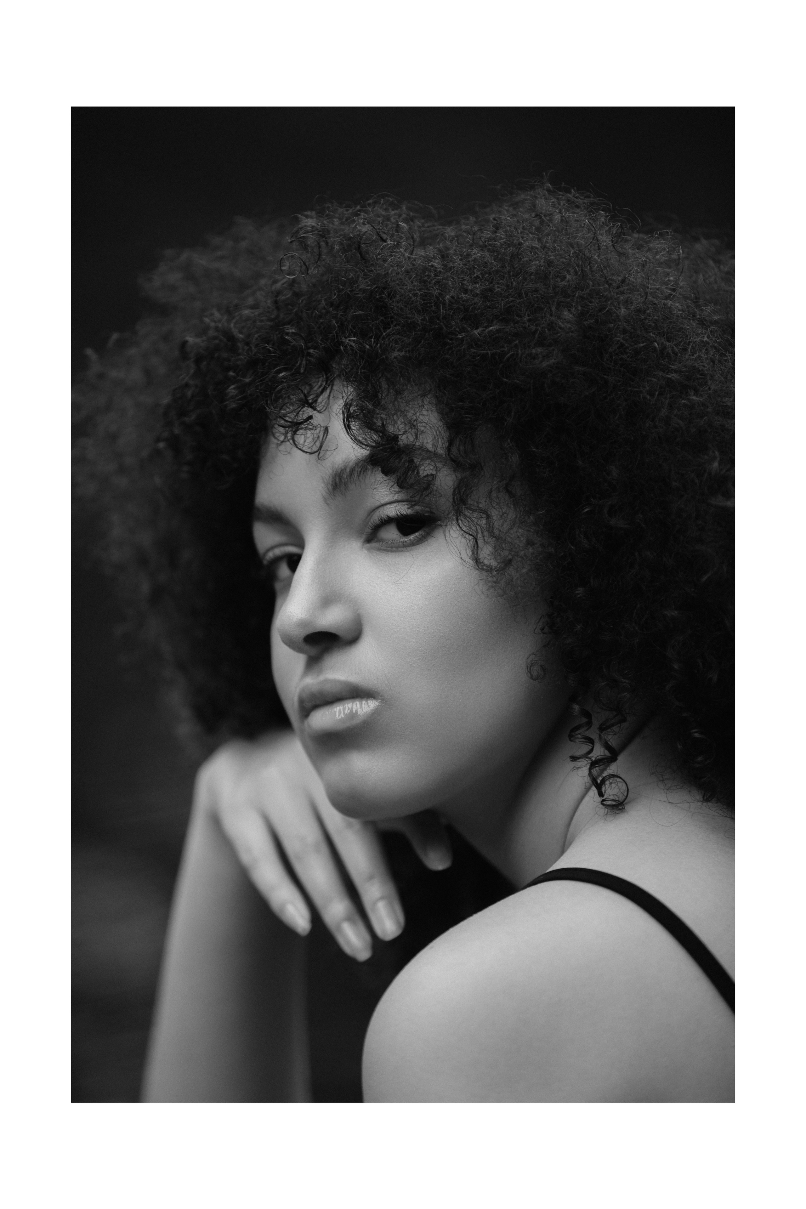 Close-up in black and white, calm expression