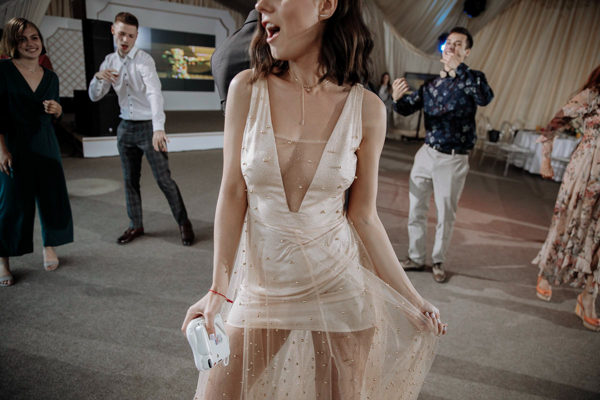 Dance floor energy, by Tanya Bodgan, Plymouth wedding photography.