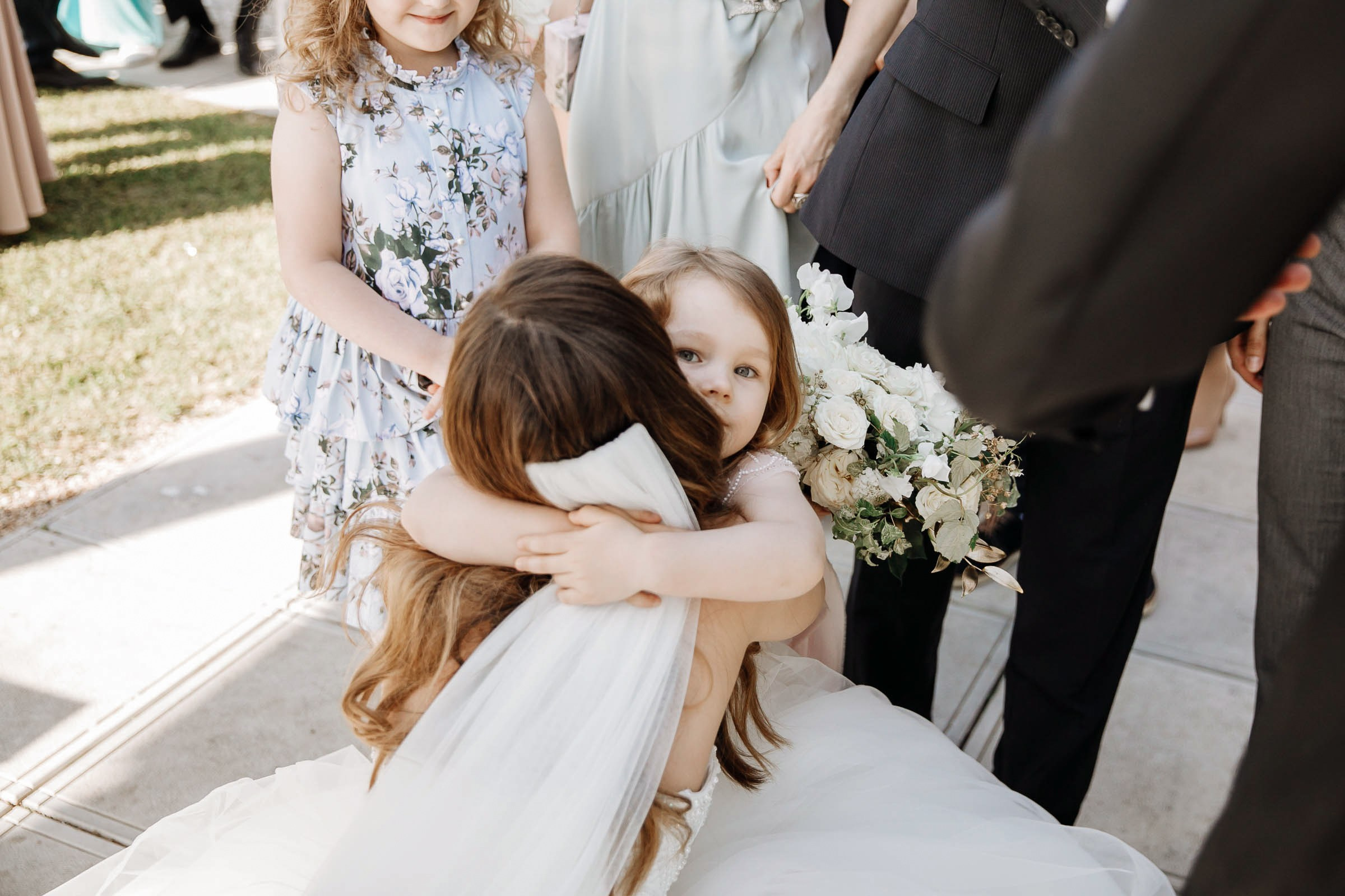 Guests at ceremony congratulating bride, by Tanya Bodgan, Bude, Cornwall wedding photography.