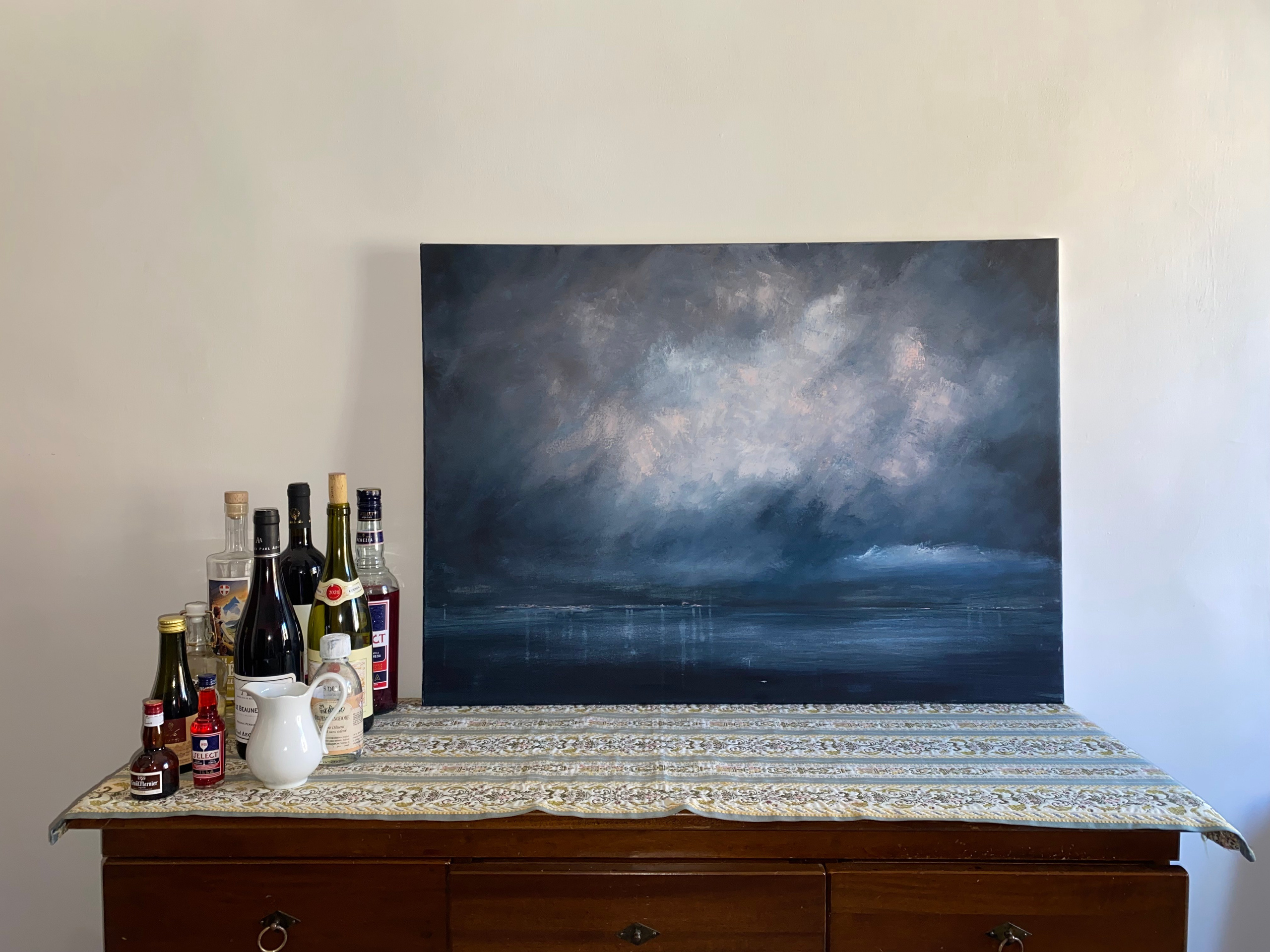 Atmospheric seascape painting in oil and acrylics, depicting a stormy sky over a dark blue ocean. Abstract impressionist work by Ekaterina Solopova showing inner turbulence and emotional landscapes and inspired by Rachmaninov classical piano music 
