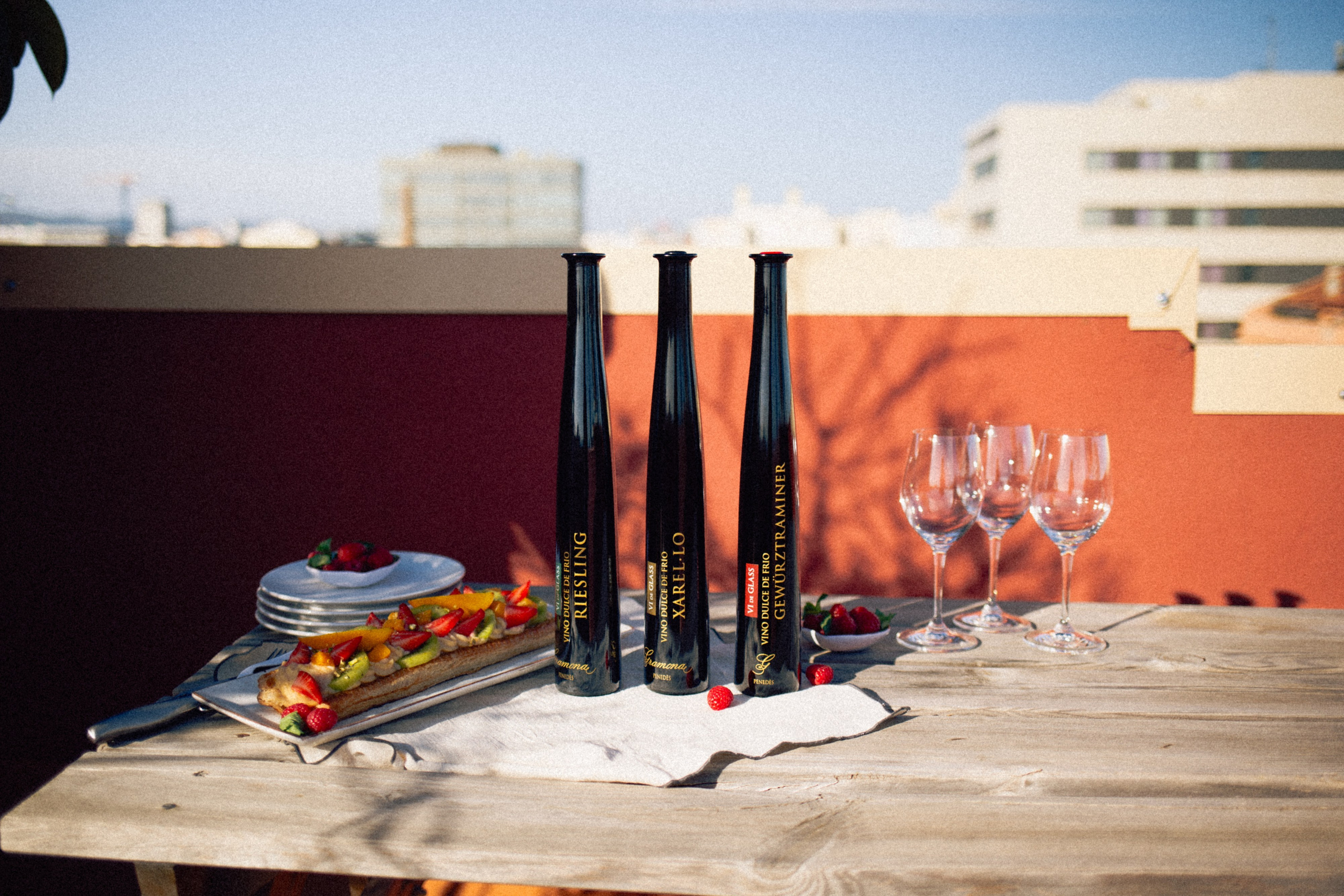 Gramona’s Vi de Glass bottles surrounded by fresh fruit and natural textures