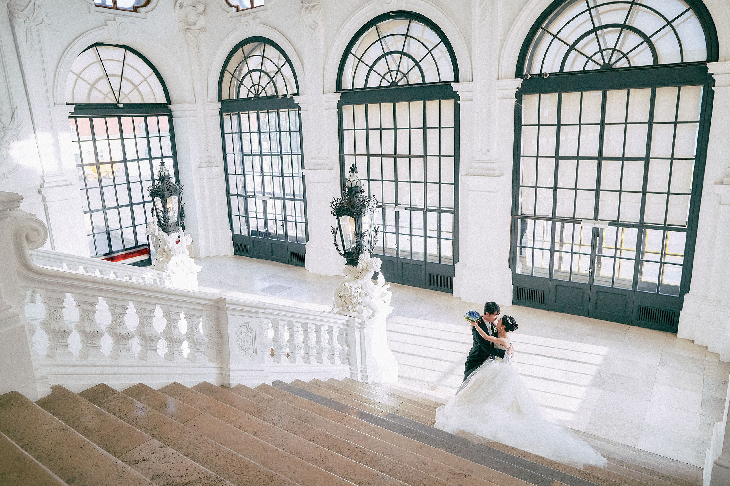 The historic Grand Staircase of the Belvedere Palace provides the wonderful background for the bride and groom.