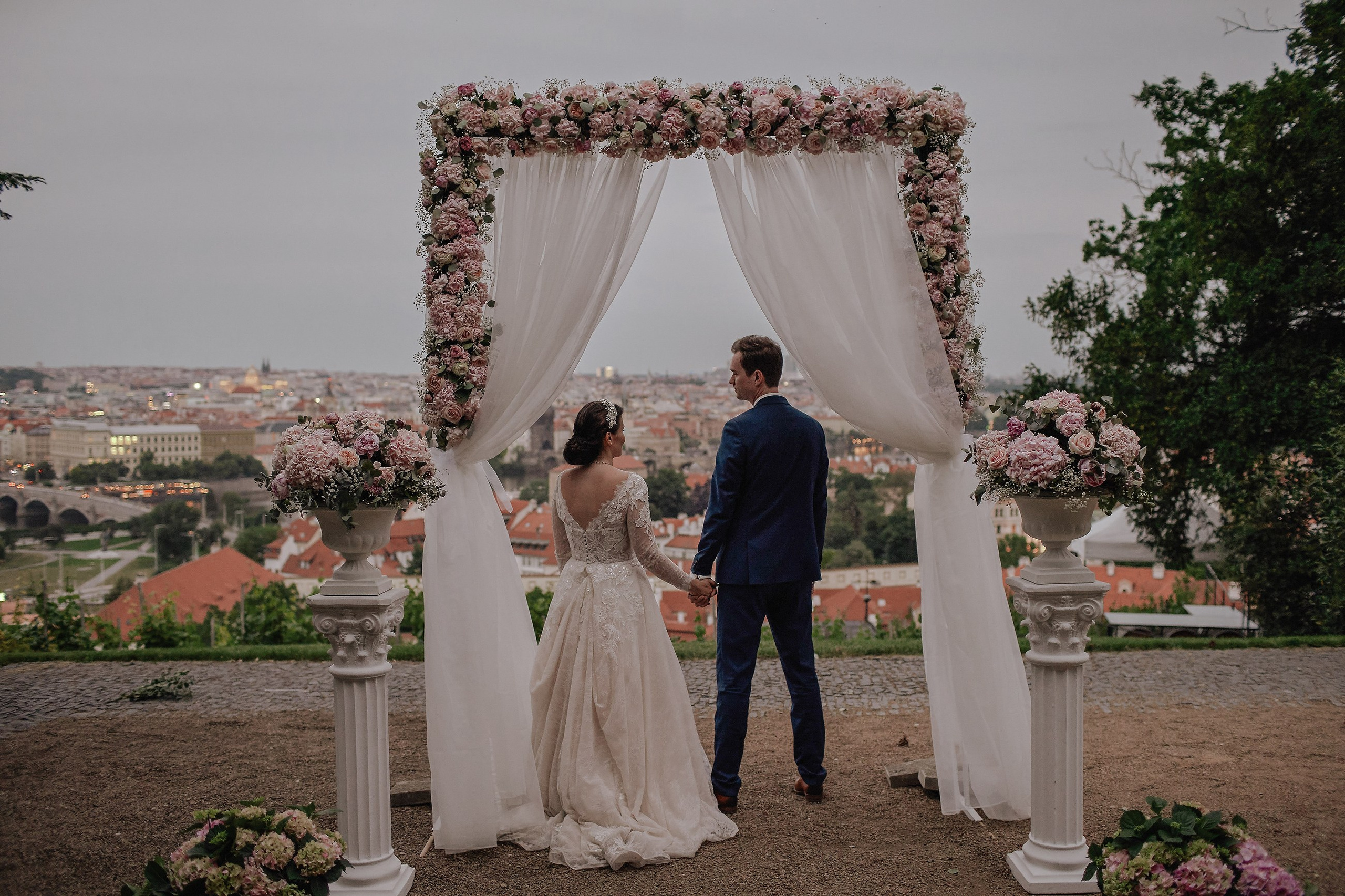 A bride & groom enjoy the view overlooking Prague from the Villa Richter during their wedding festivities