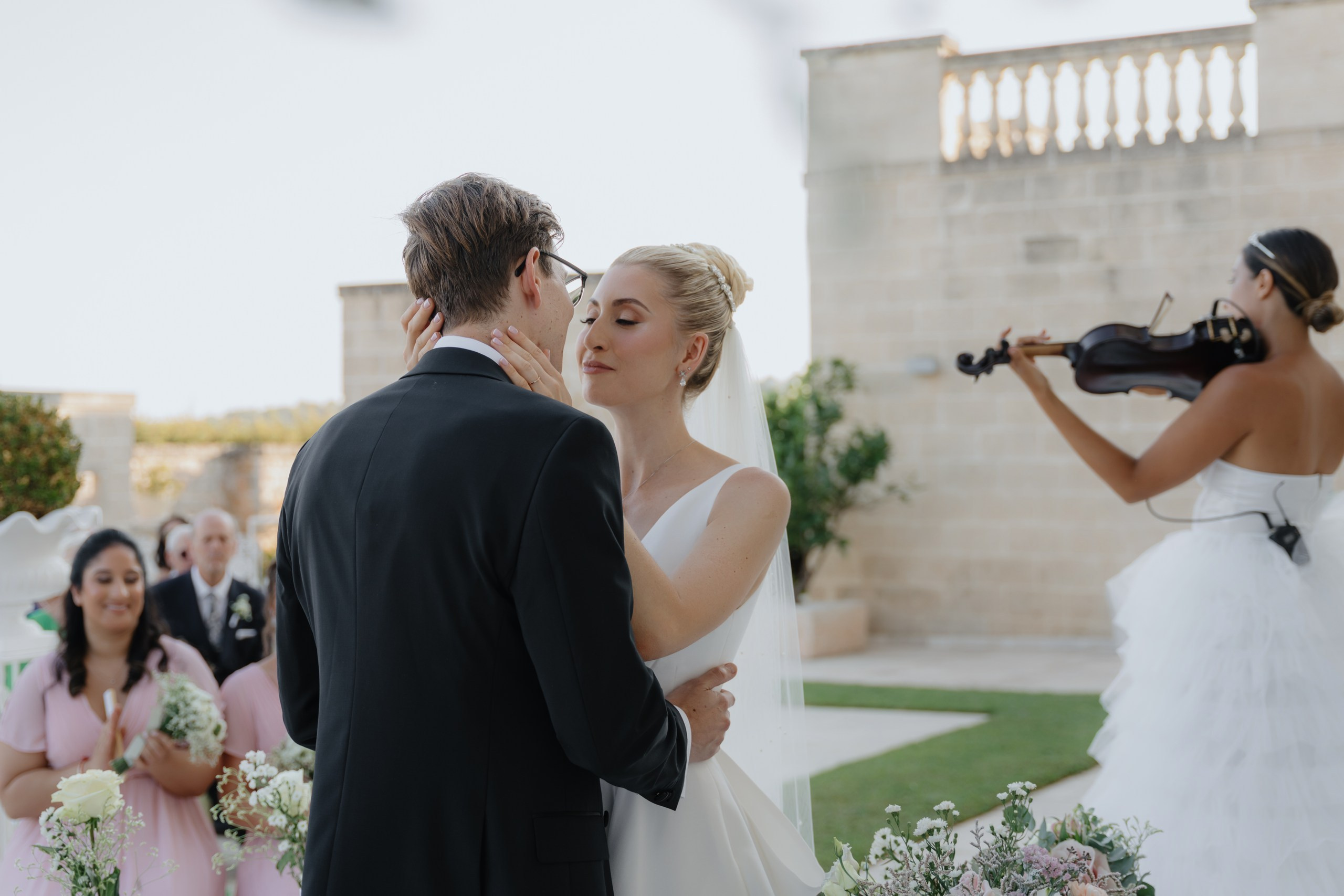 Outdoor wedding ceremony at Masseria Traetta Exclusive Ostuni Italy