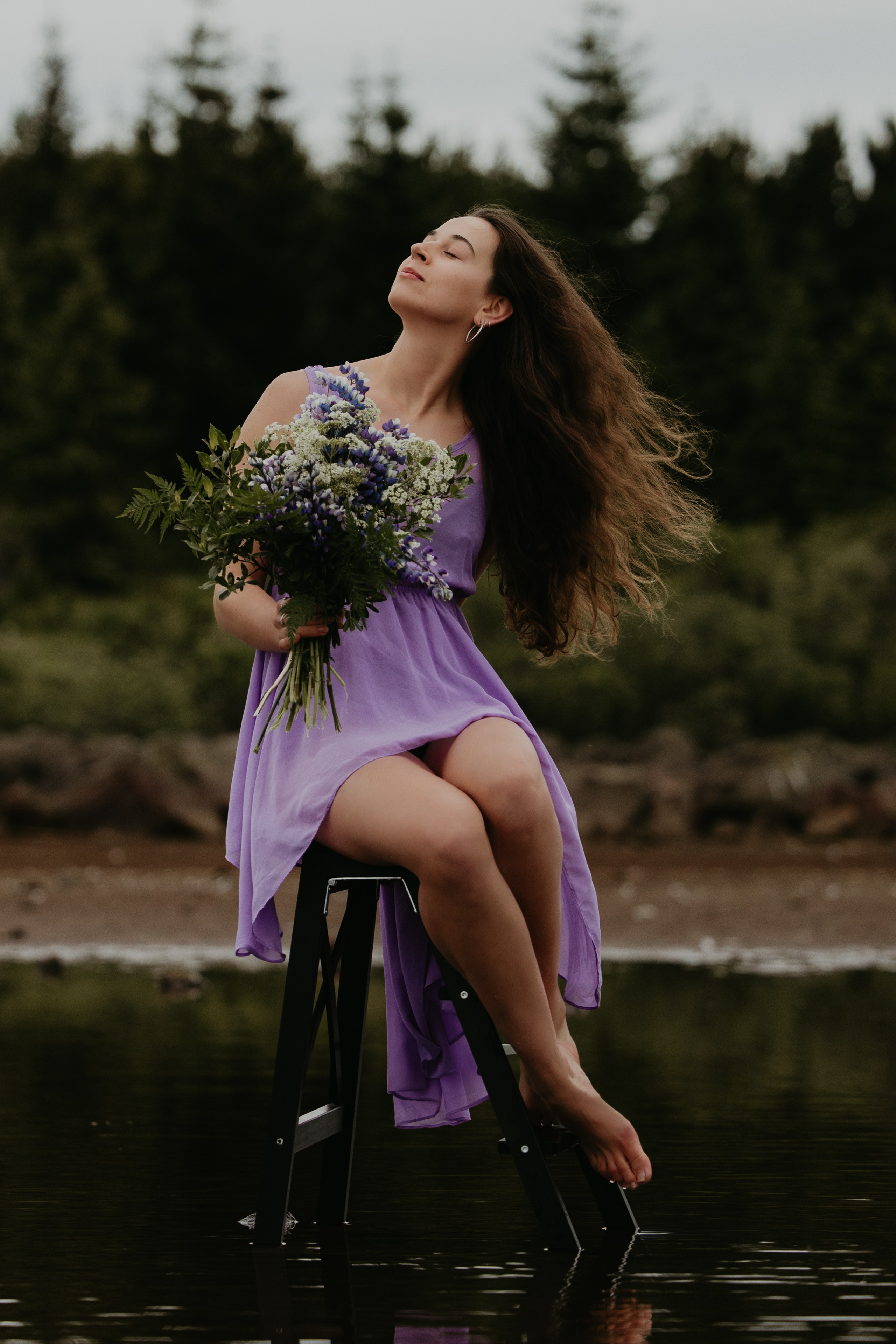 Wind in her hair—dreamy feminine portrait in Iceland’s dramatic natural scenery.