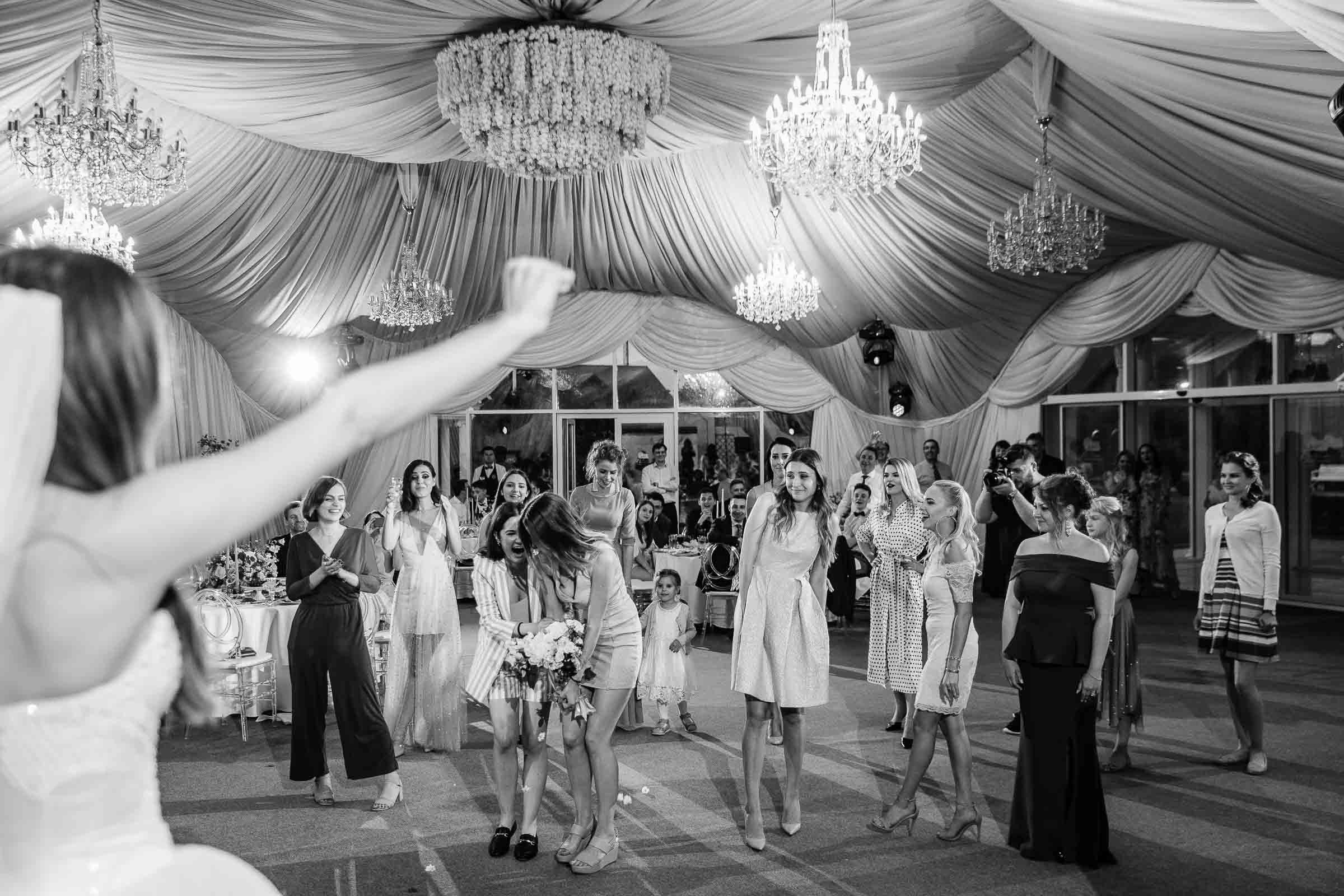 Bouquet toss catch, by Tanya Bodgan, Cornwall wedding photographer.