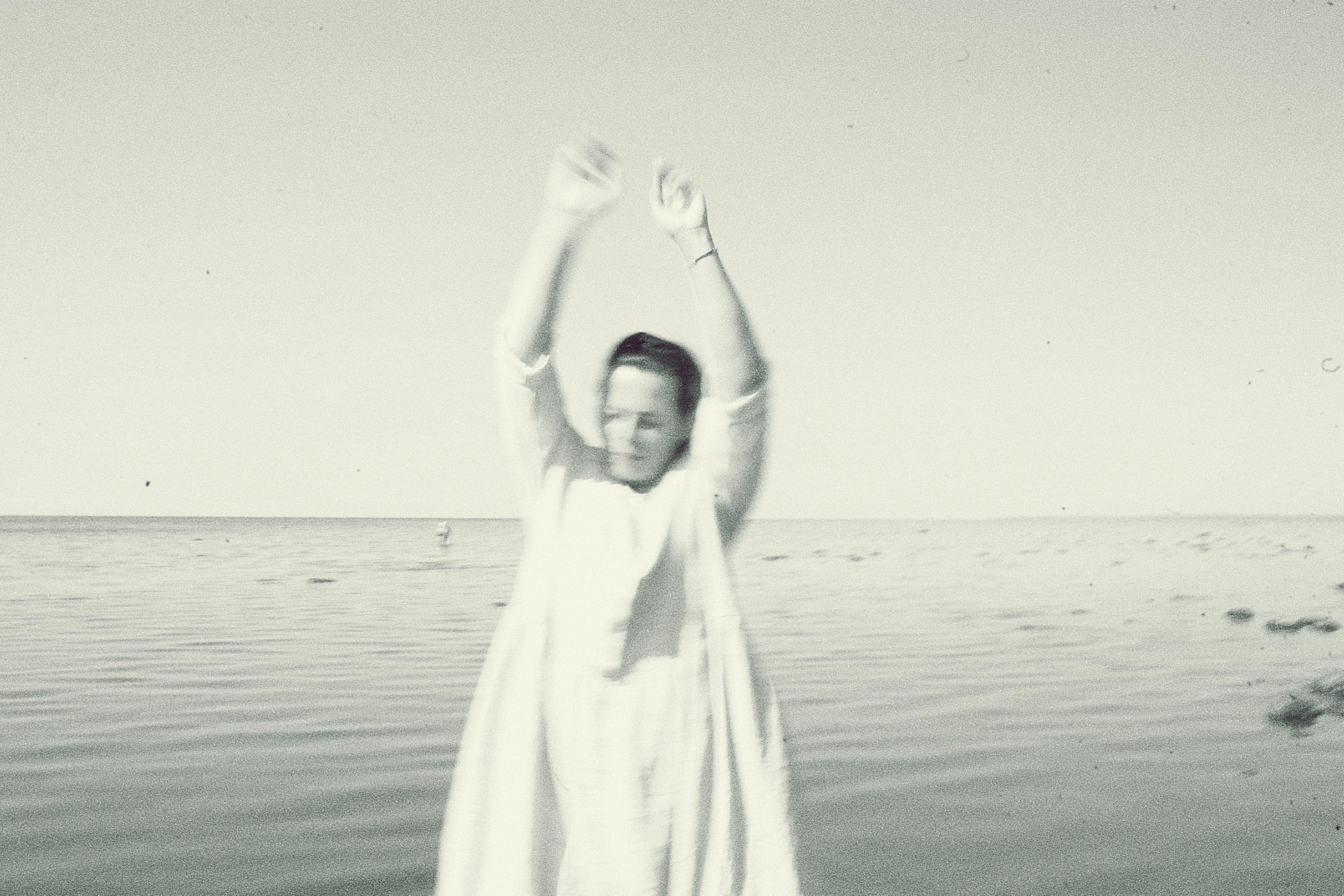 Anna, by herself. Stones and sand. Victoria Dini. Art photography in London / Folkestone, UK