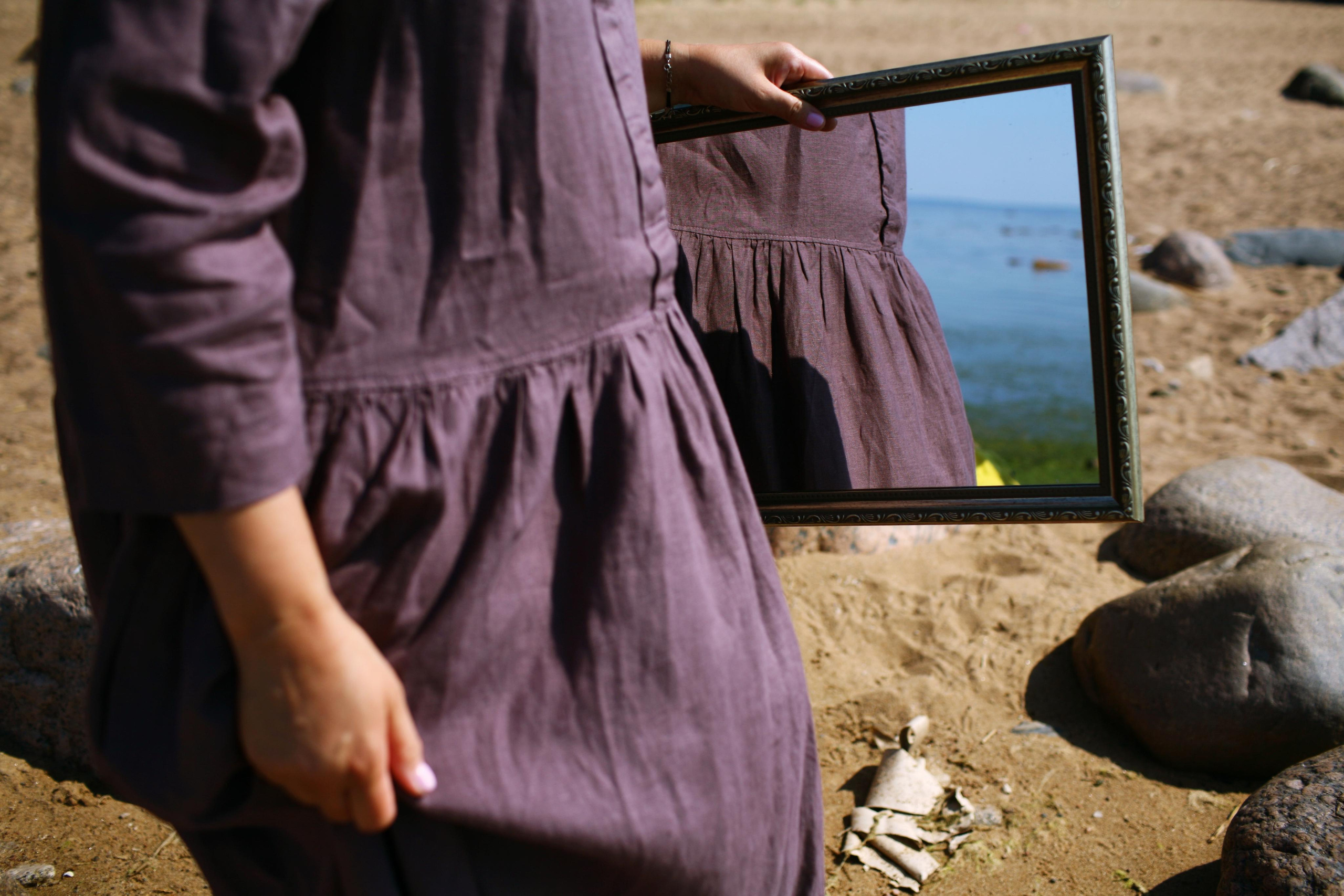 Anna, by herself. Stones and sand. Victoria Dini. Art photography in London / Folkestone, UK
