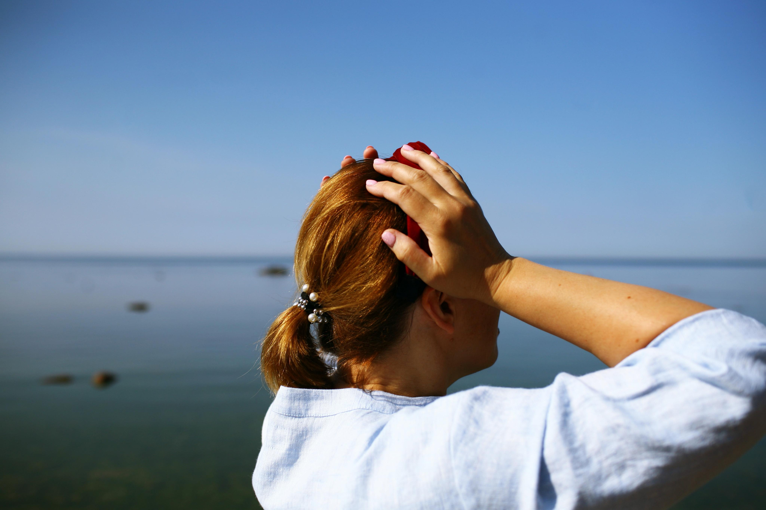 Anna, by herself. Stones and sand. Victoria Dini. Art photography in London / Folkestone, UK