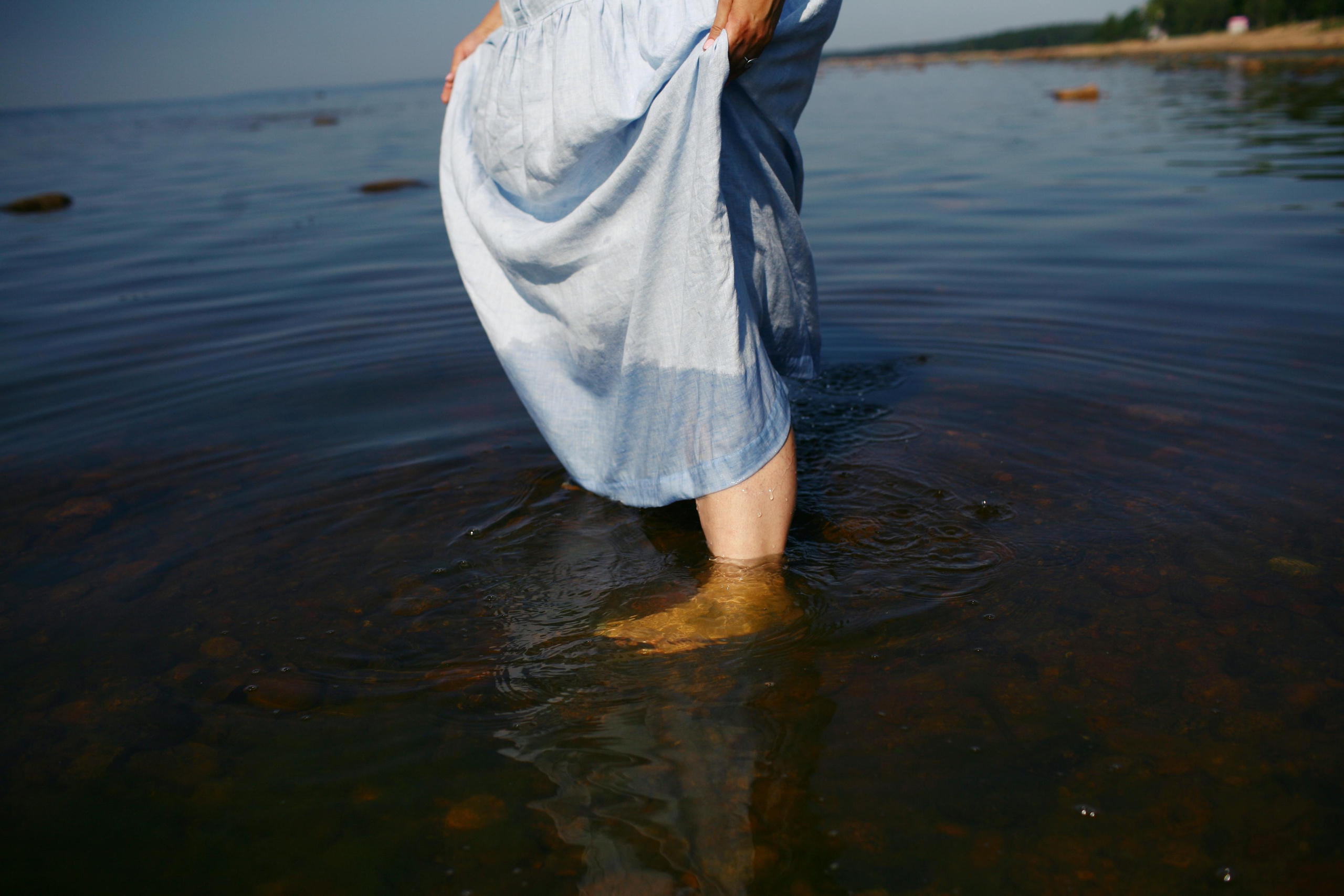 Anna, by herself. Stones and sand. Victoria Dini. Art photography in London / Folkestone, UK