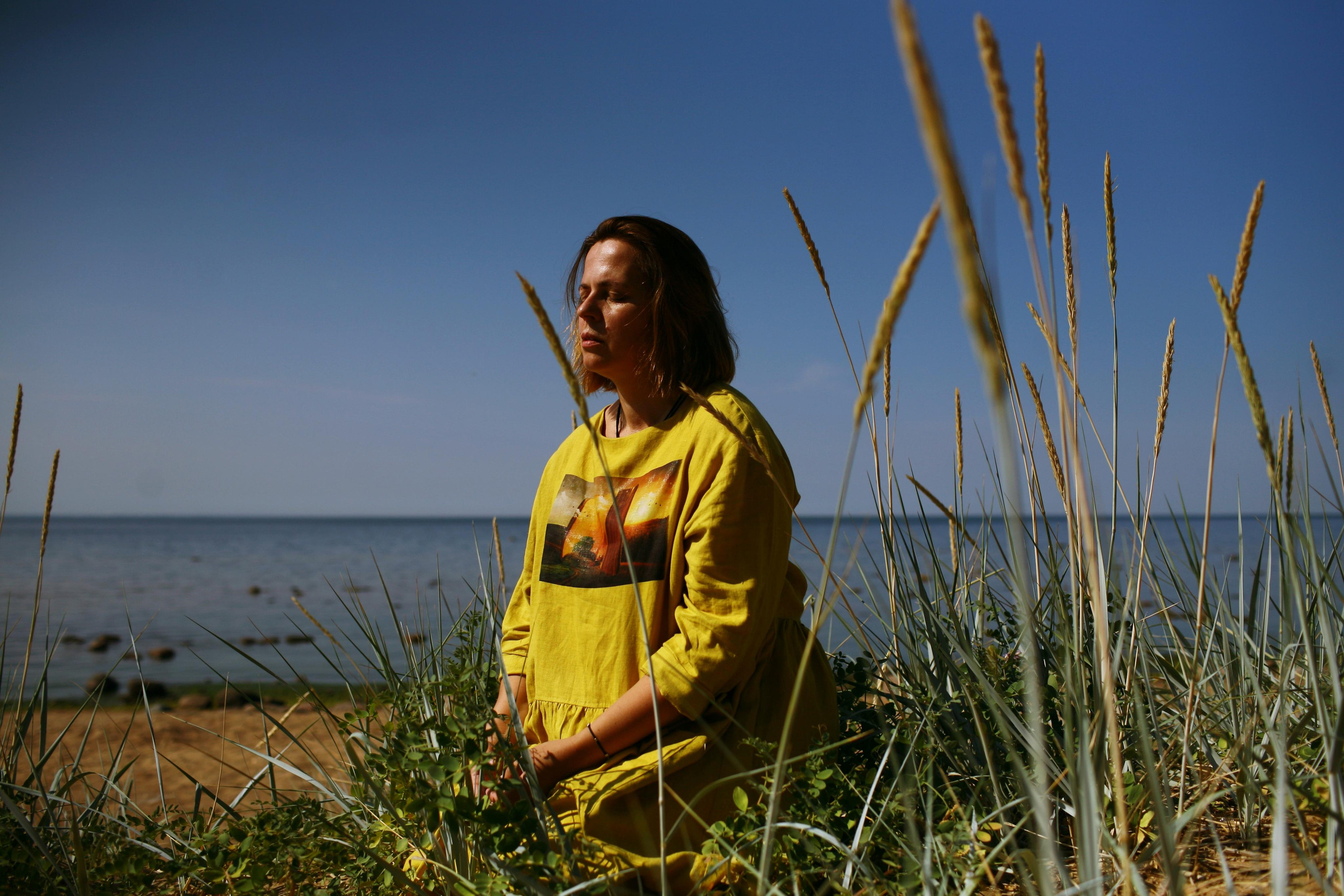 Anna, by herself. Stones and sand. Victoria Dini. Art photography in London / Folkestone, UK