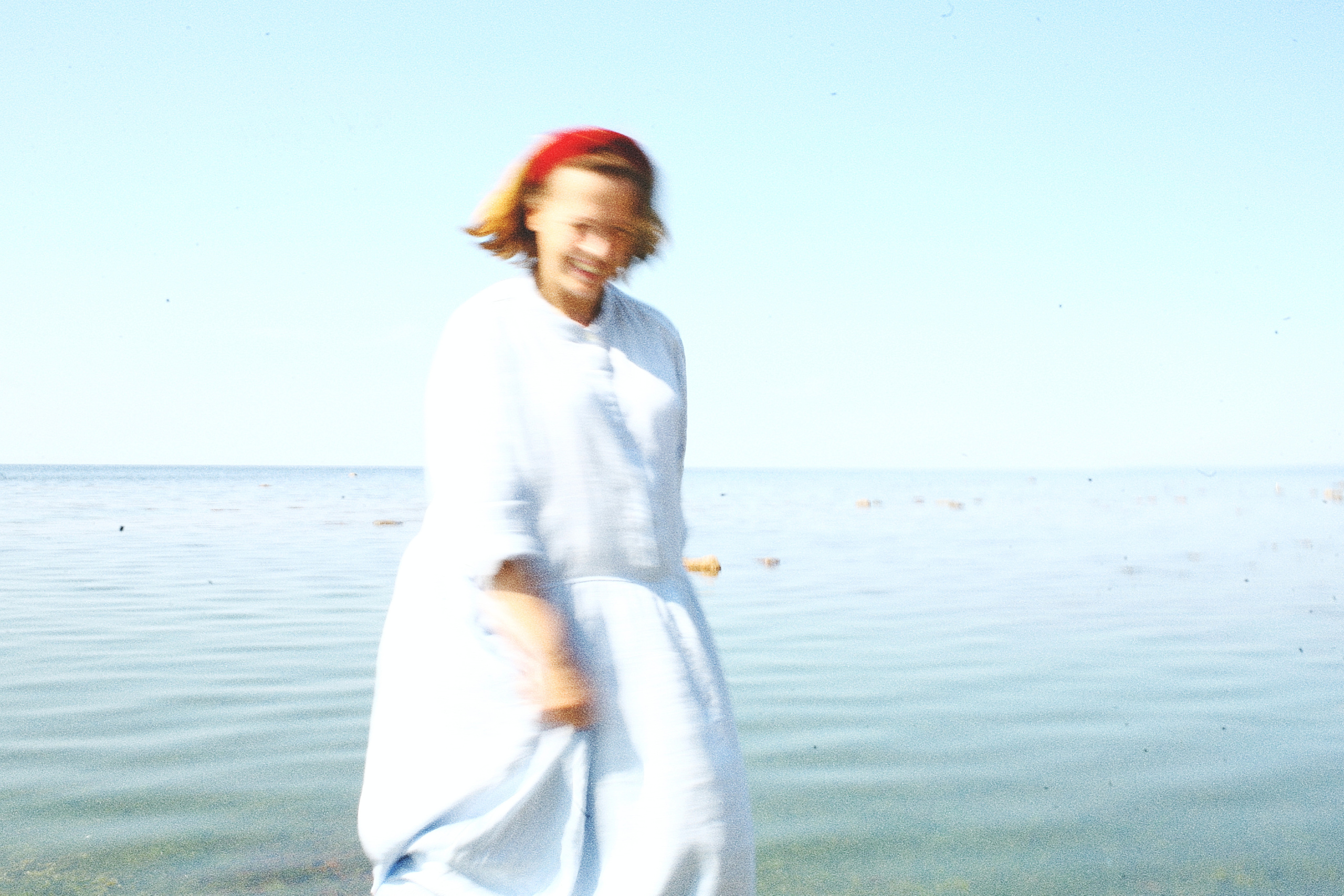 Anna, by herself. Stones and sand. Victoria Dini. Art photography in London / Folkestone, UK