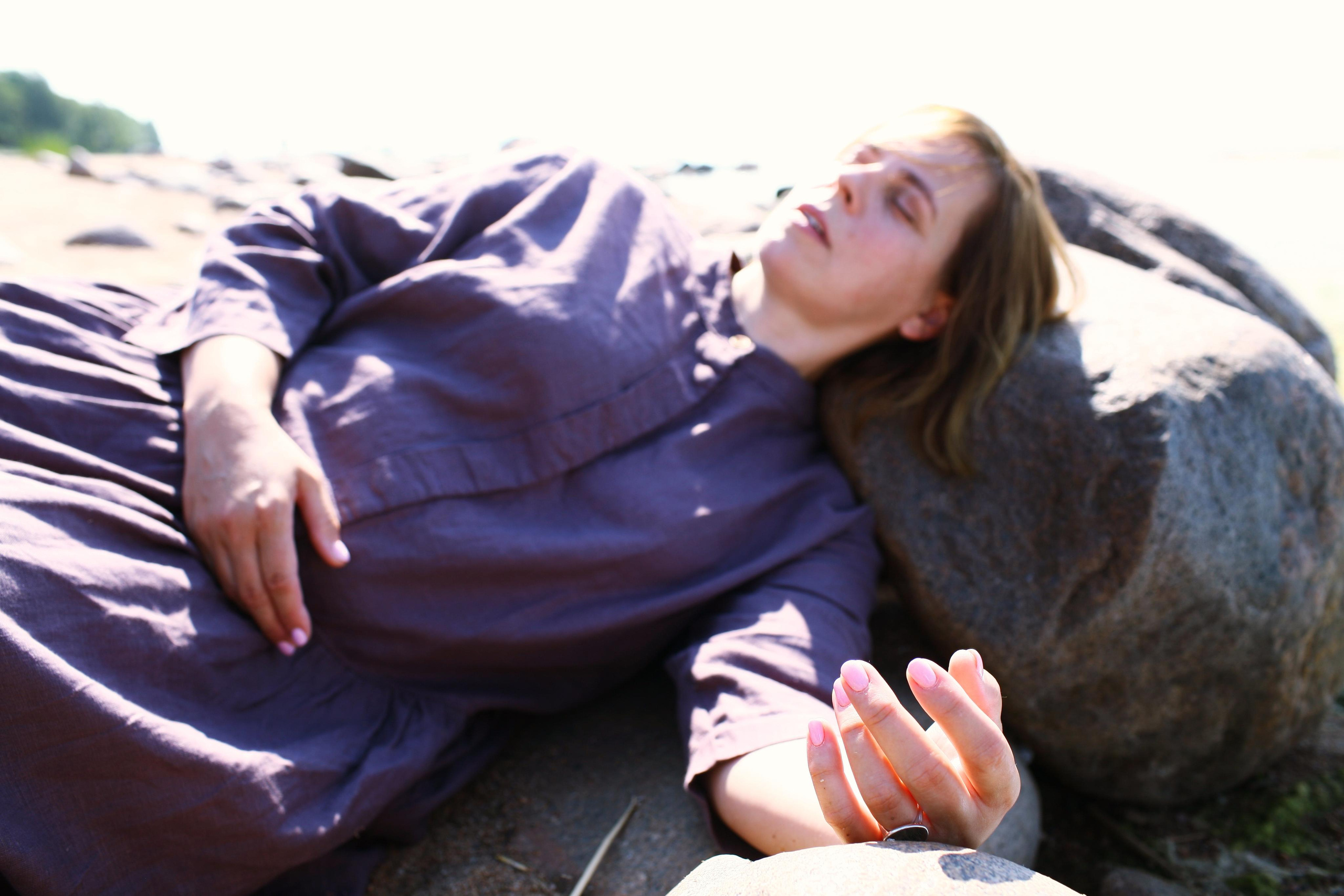 Anna, by herself. Stones and sand. Victoria Dini. Art photography in London / Folkestone, UK