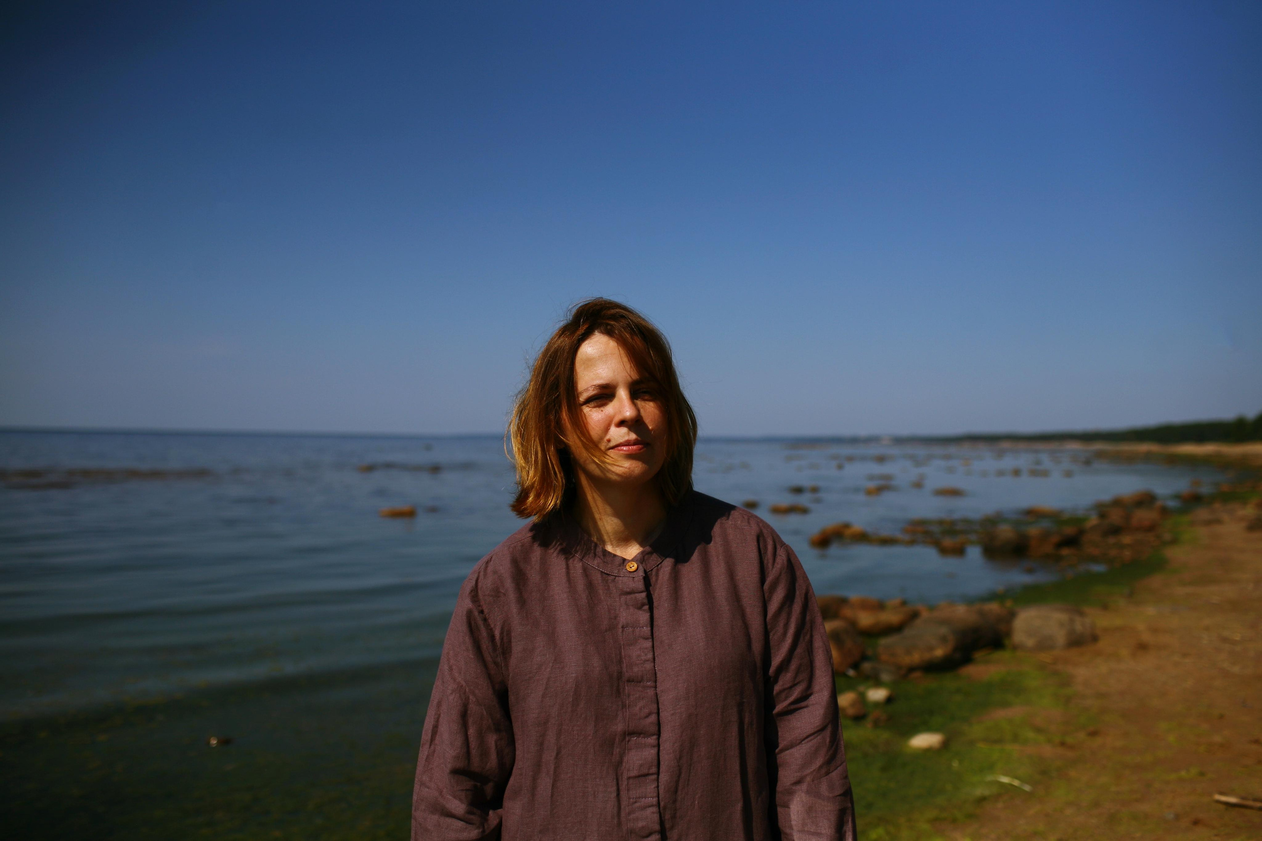 Anna, by herself. Stones and sand. Victoria Dini. Art photography in London / Folkestone, UK