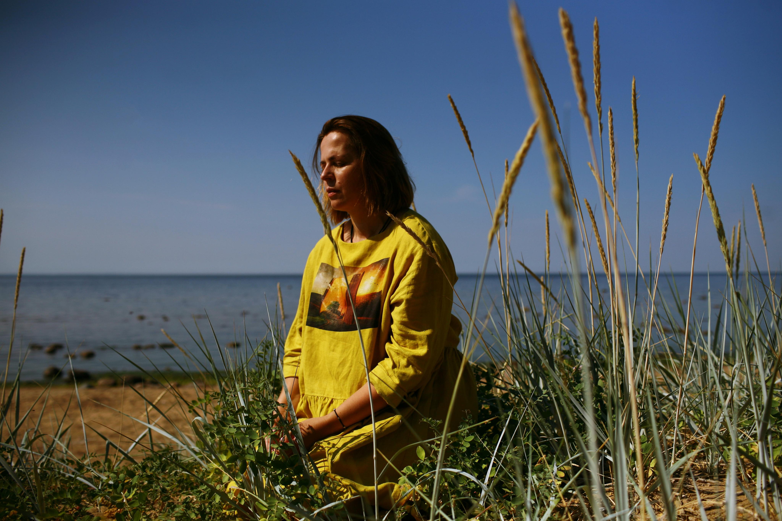 Anna, by herself. Stones and sand. Victoria Dini. Art photography in London / Folkestone, UK