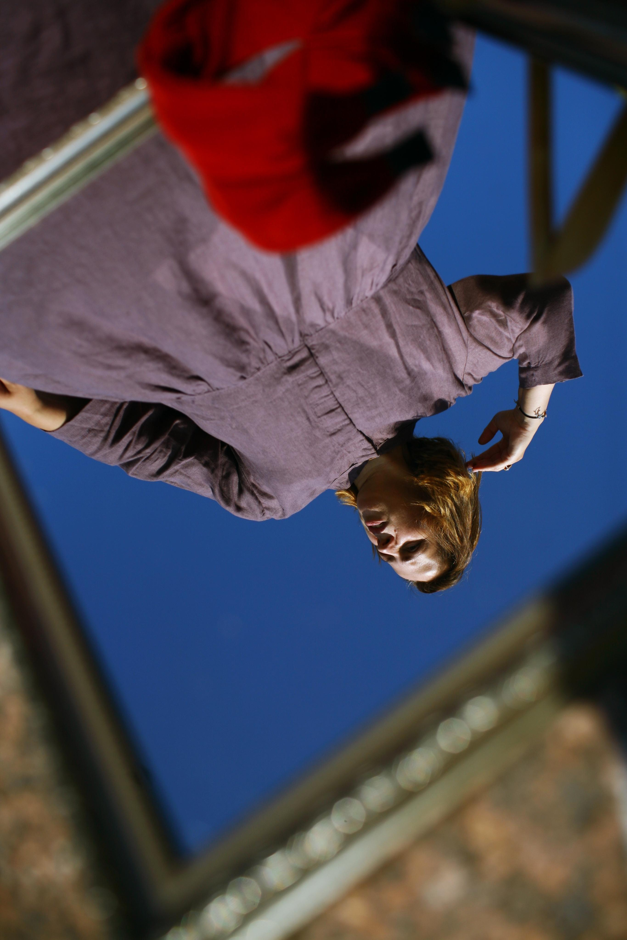 Anna, by herself. Stones and sand. Victoria Dini. Art photography in London / Folkestone, UK