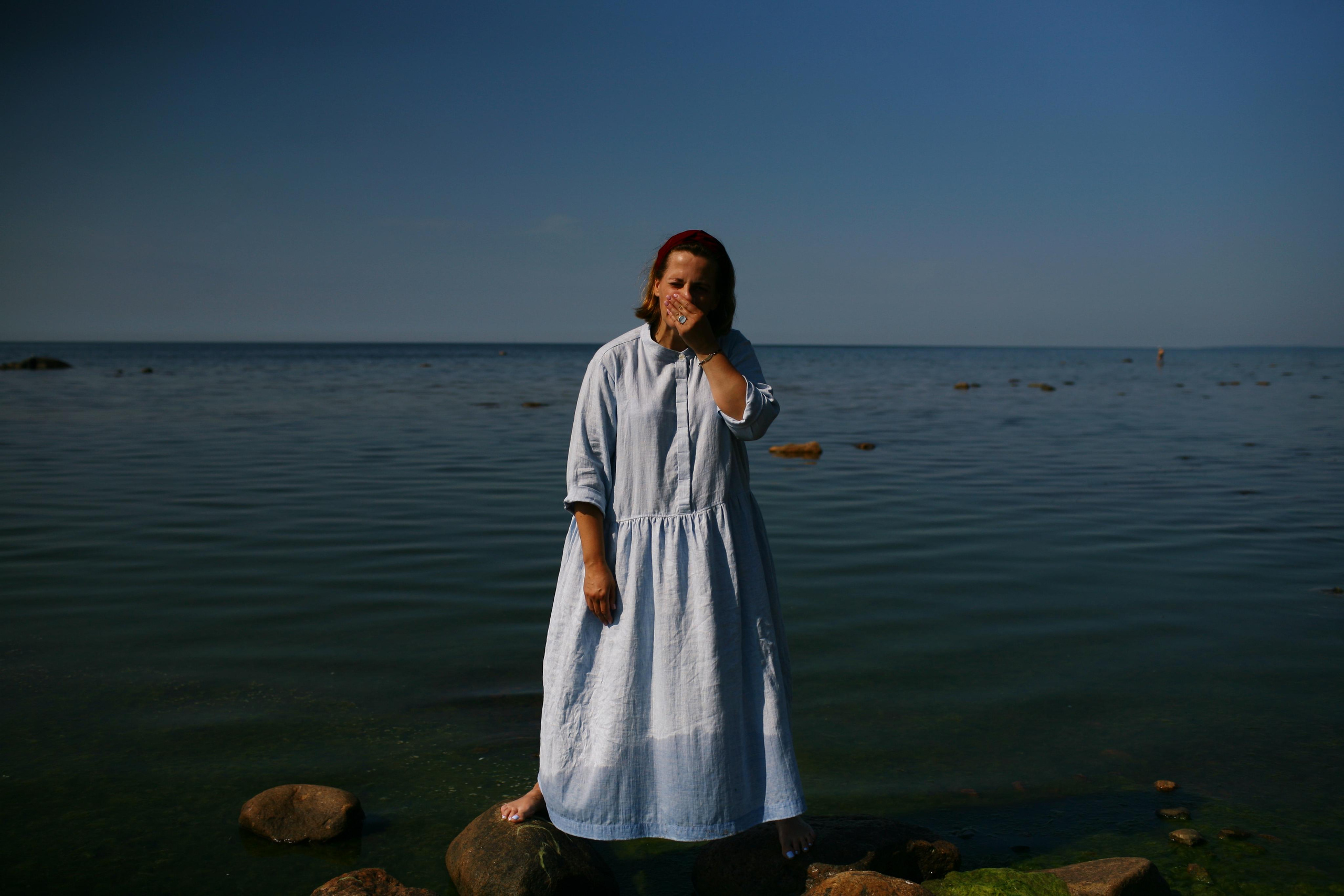 Anna, by herself. Stones and sand. Victoria Dini. Art photography in London / Folkestone, UK
