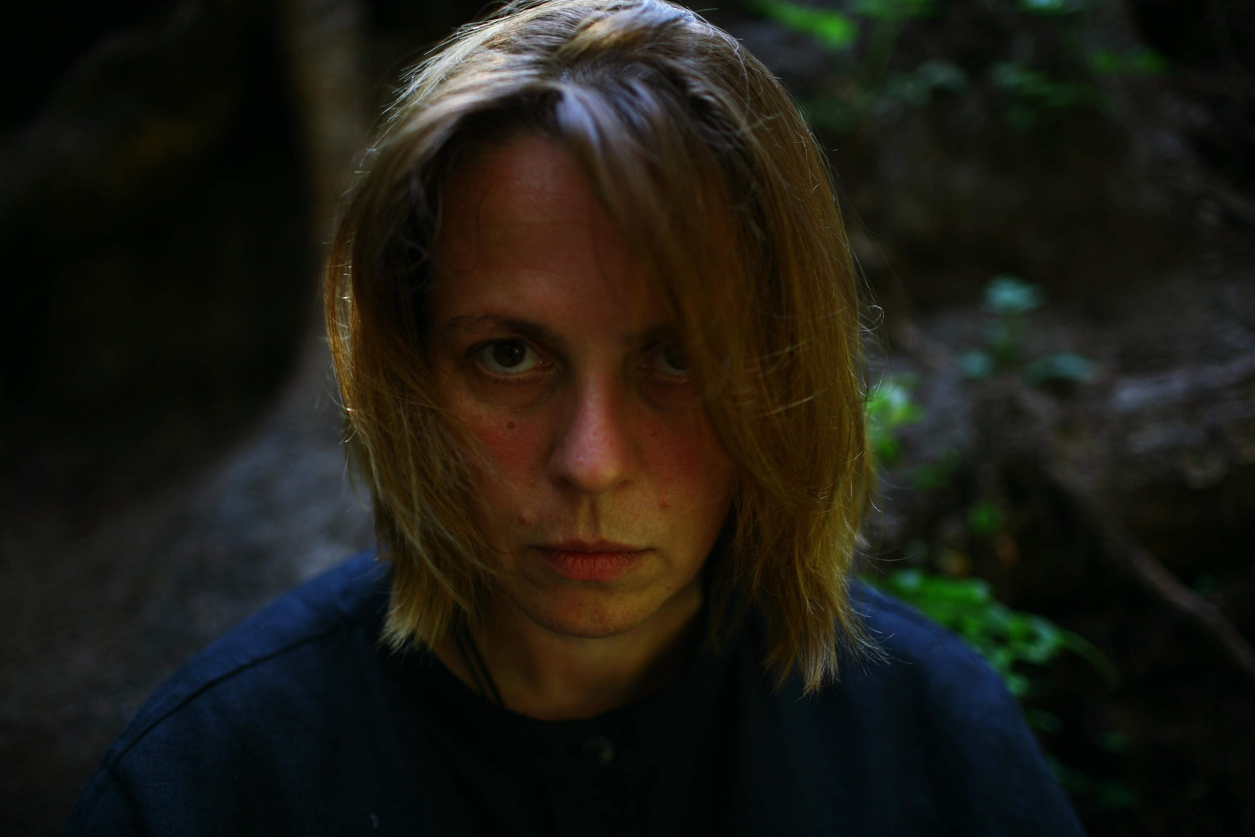 Anna, by herself. Woods and a little bit fire. Victoria Dini. Art photography in London / Folkestone, UK