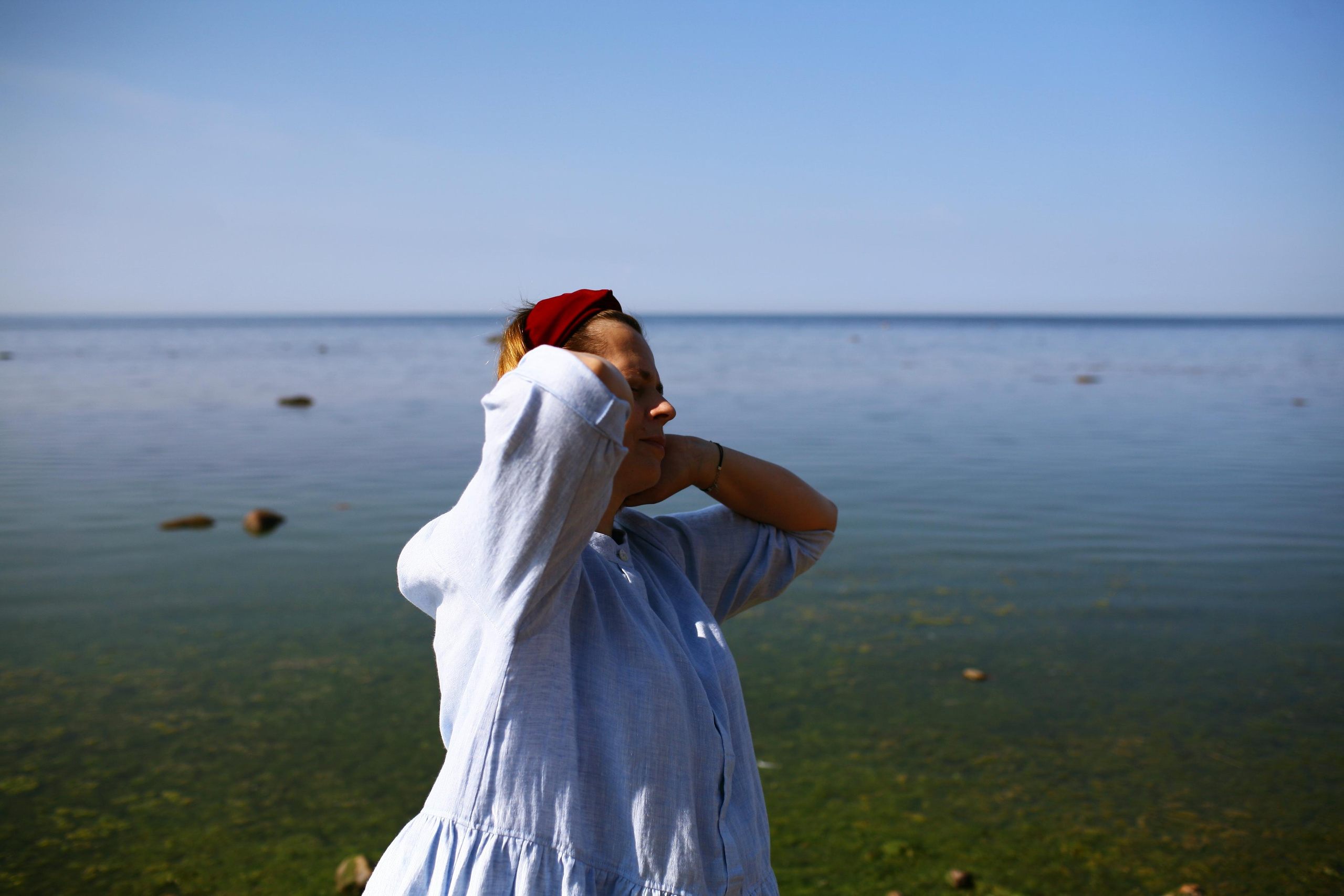 Anna, by herself. Stones and sand. Victoria Dini. Art photography in London / Folkestone, UK