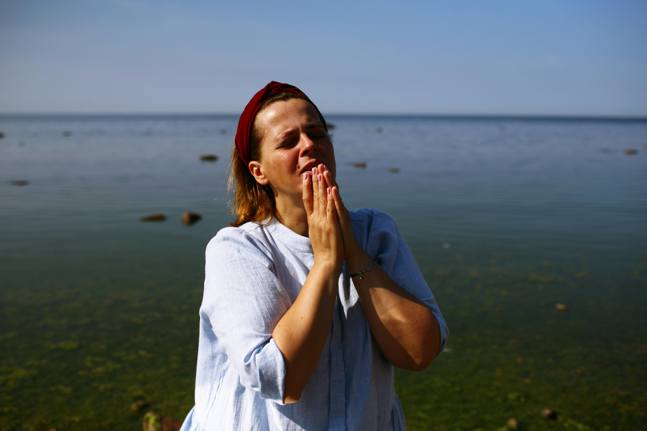 Anna, by herself. Stones and sand. Victoria Dini. Art photography in London / Folkestone, UK