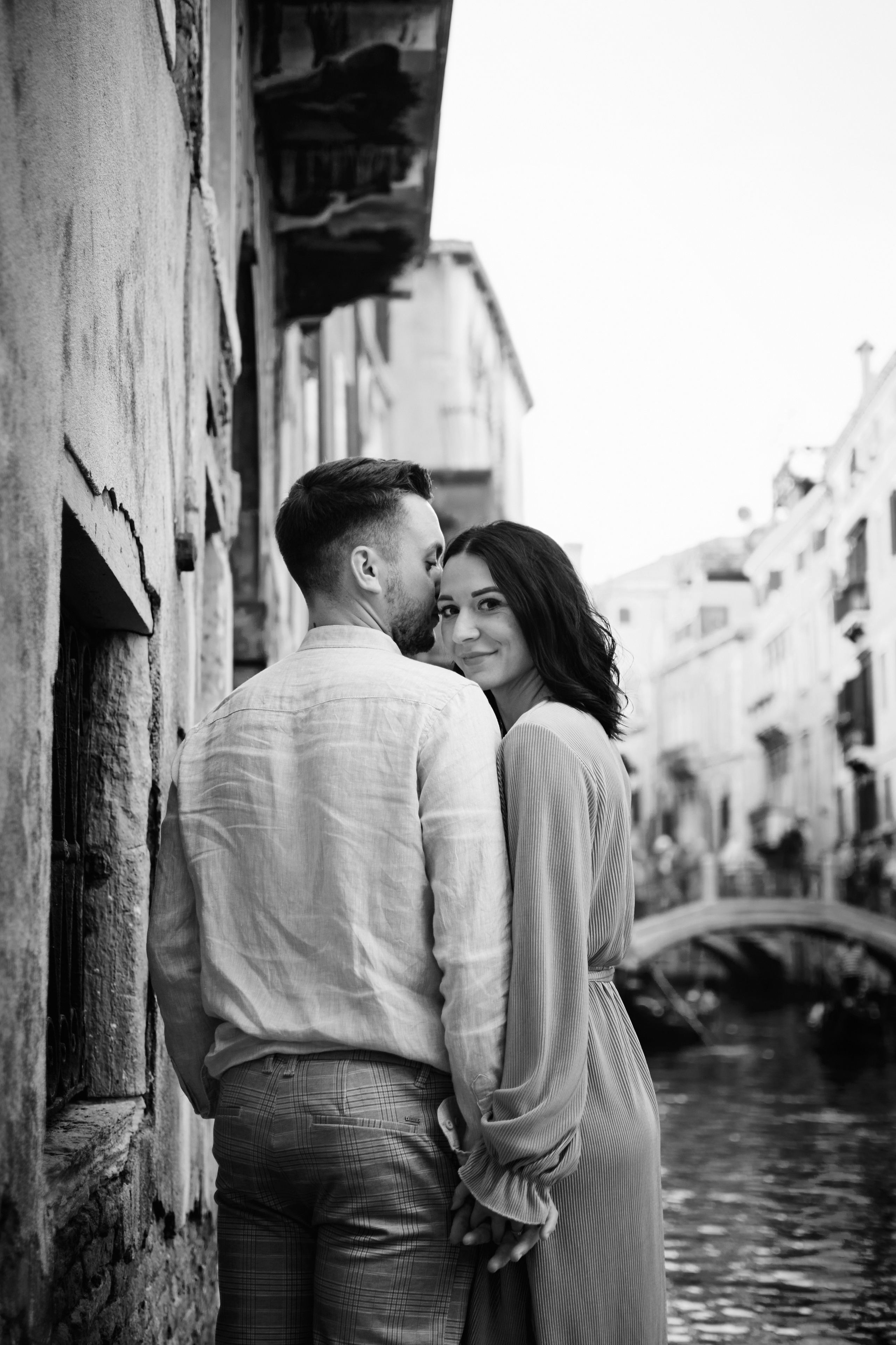  bride and groom exchange vows in an intimate Venetian wedding ceremony, surrounded by the city's beauty.