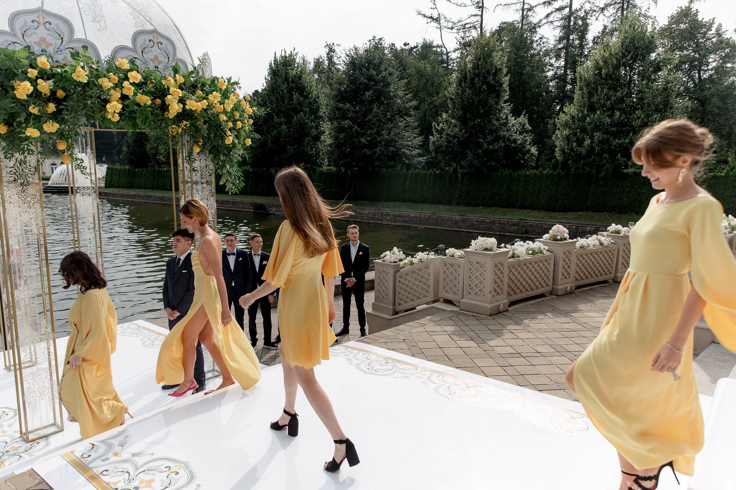 Bridesmaids walk to ceremony, by Bude, Cornwall reportage photographer.