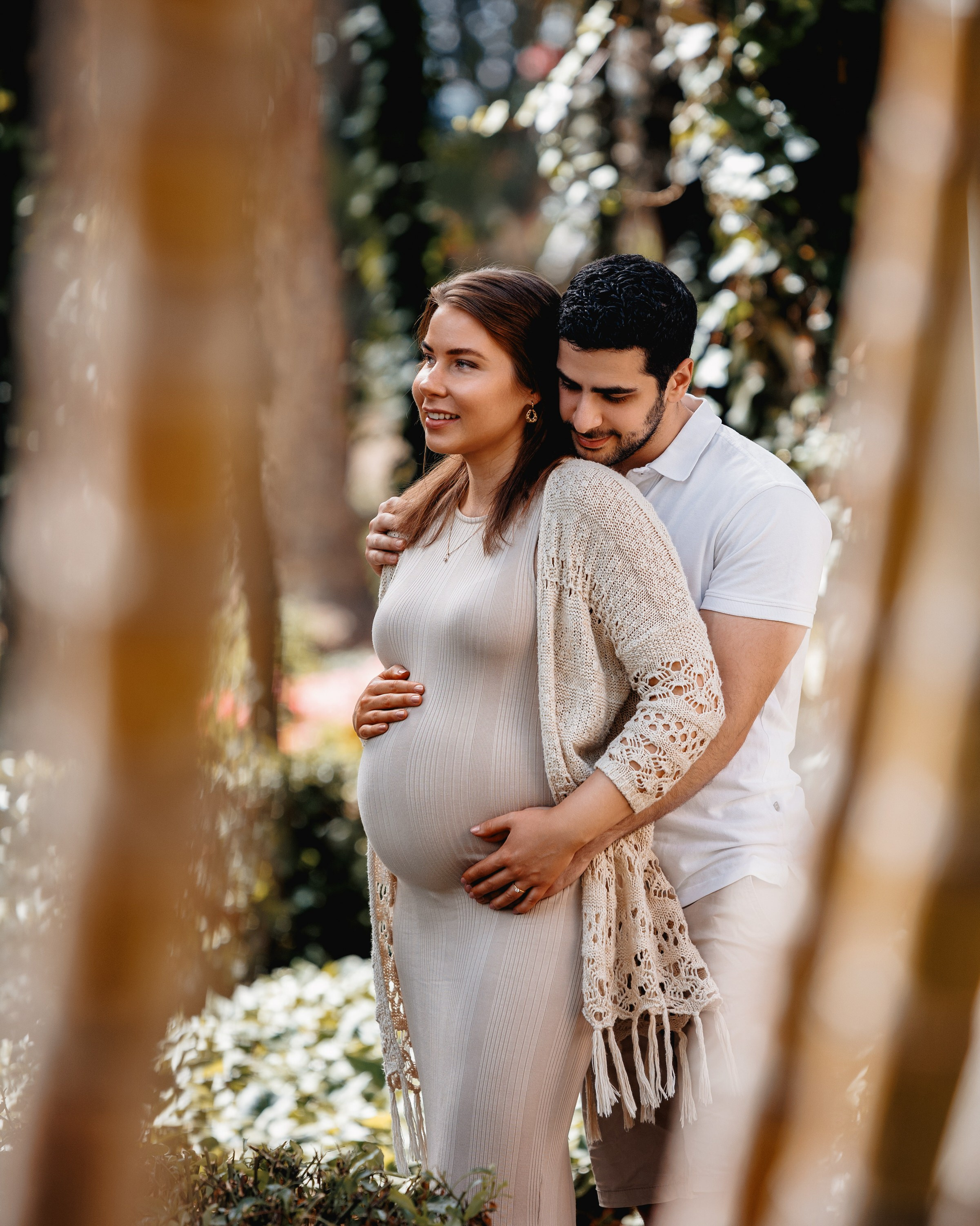 Photo shoot  A pregnant couple embracing in a garden. Gran Canaria Island