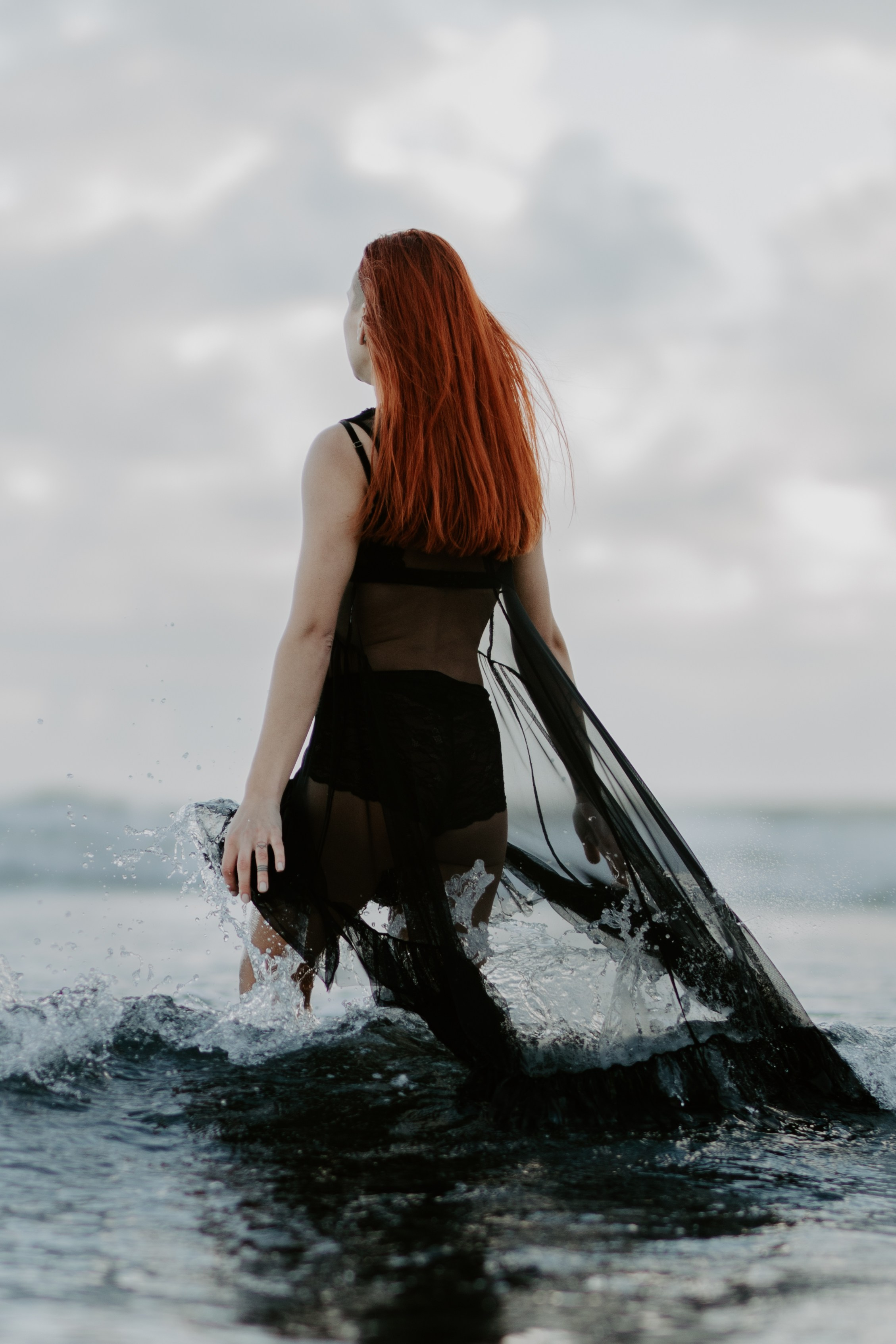 Empowering outdoor boudoir session in Iceland’s wild nature, embracing confidence and self-expression.