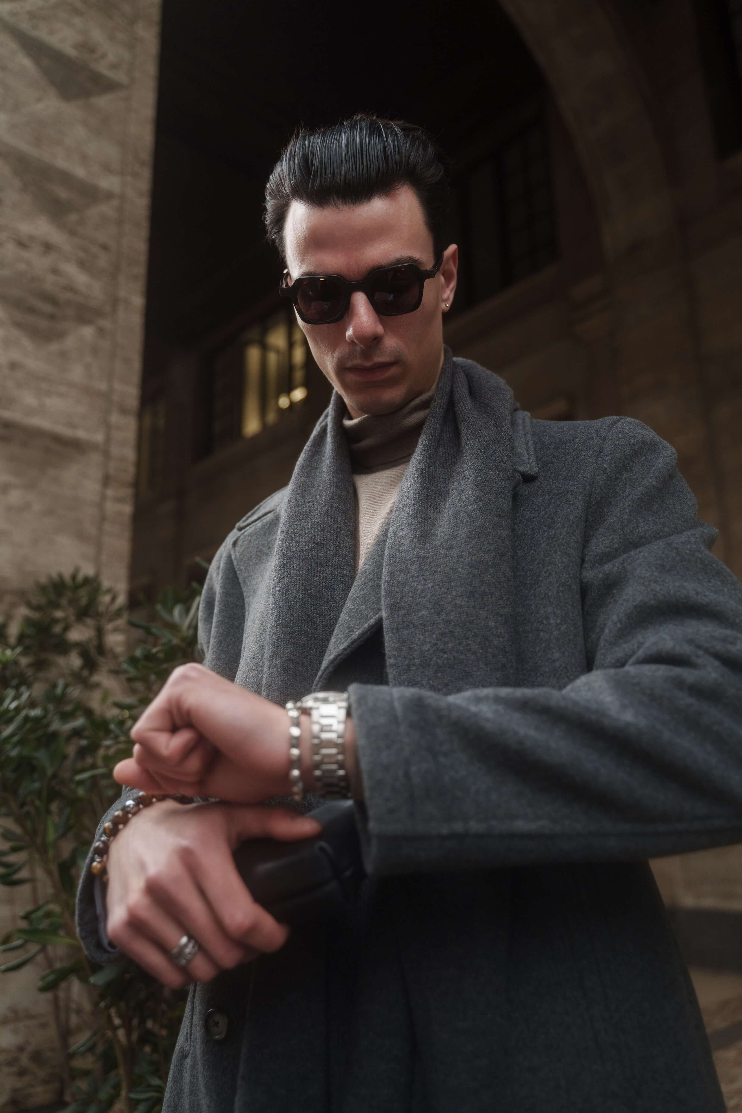 Fashion photographer Milan – male model in sunglasses checking time during eyewear campaign