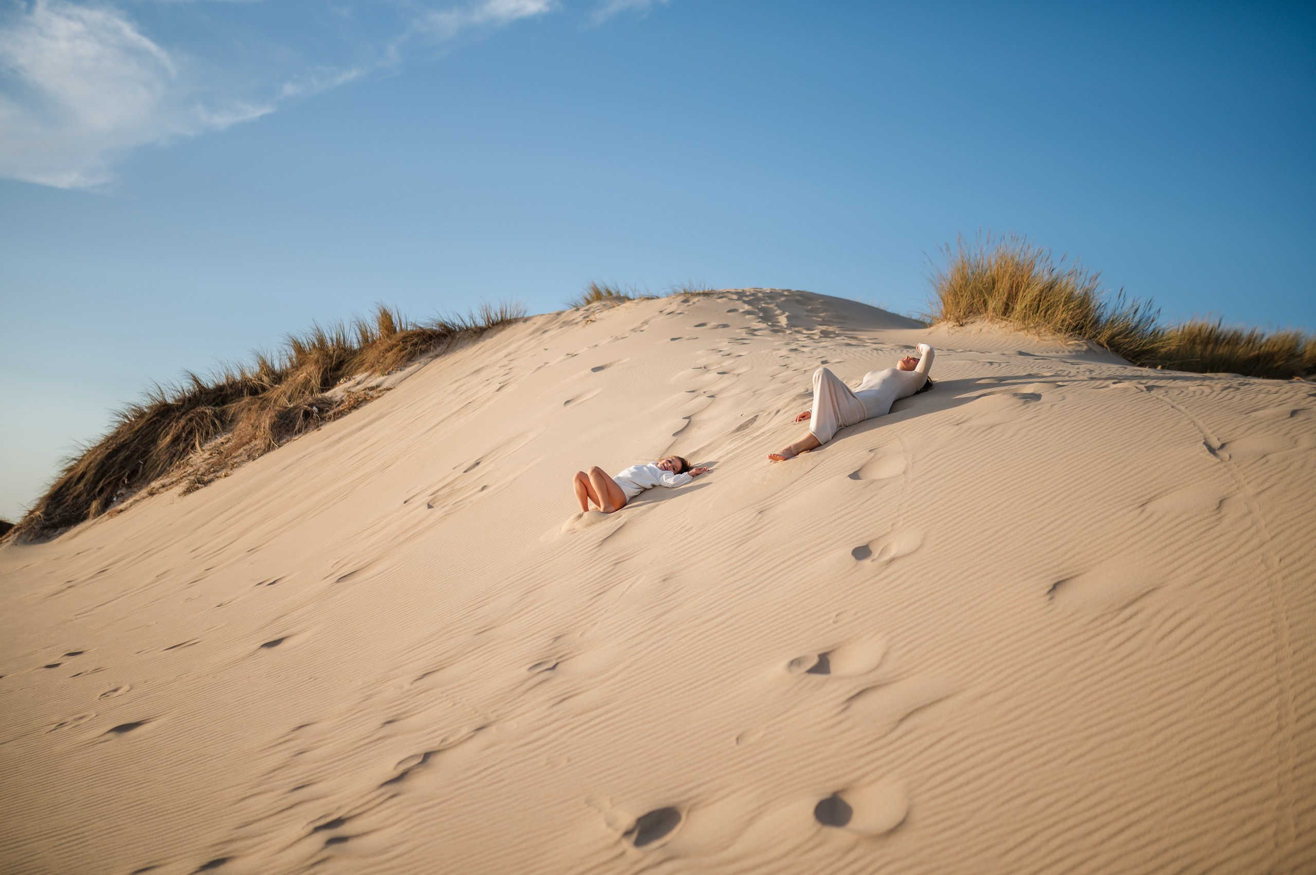 Family photo shoot for mum and daughter on Guincho beach, Portugal