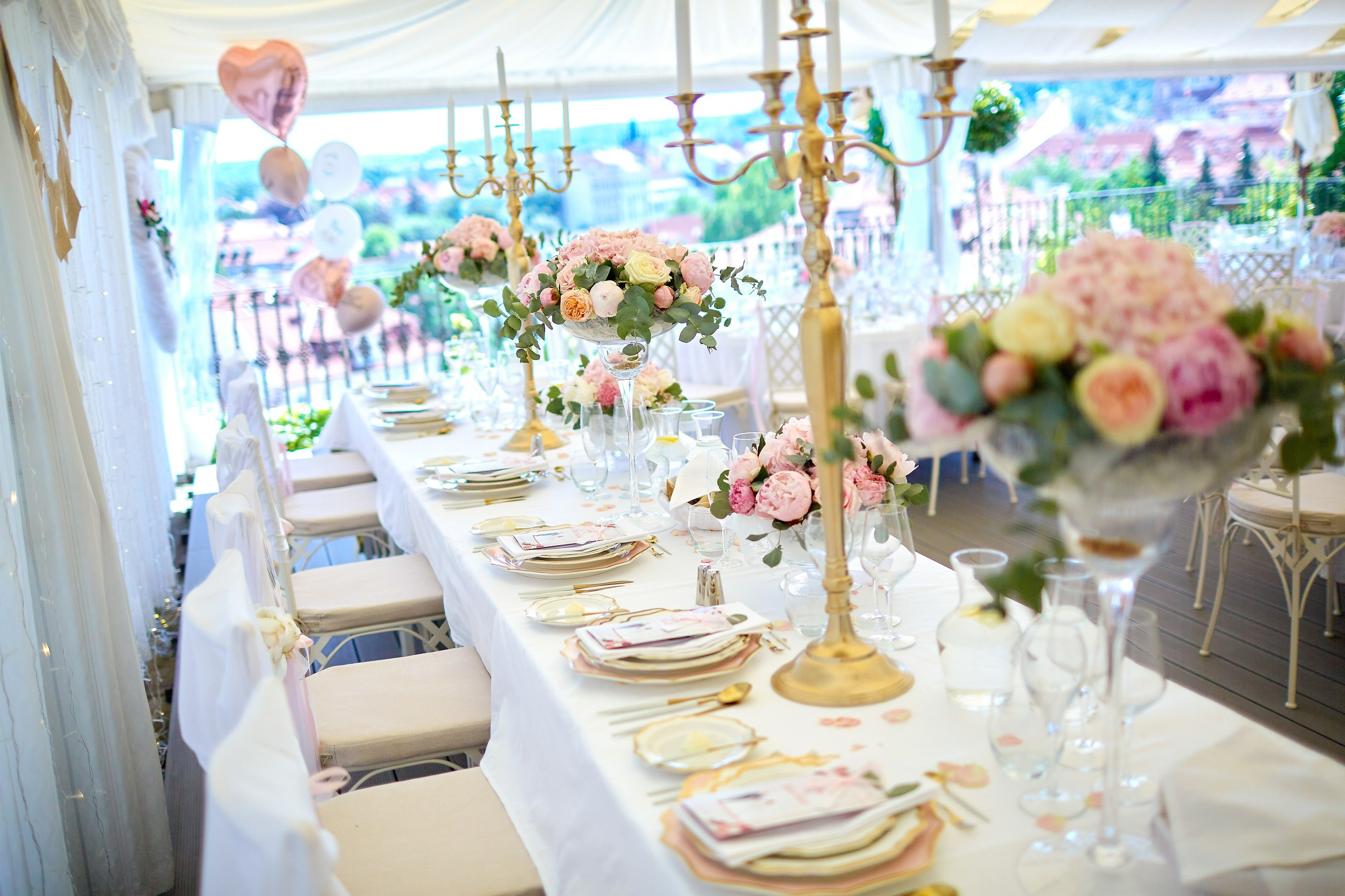 A wide angle image captures the candlelit ambience of the wedding reception dinner at the Villa Richter