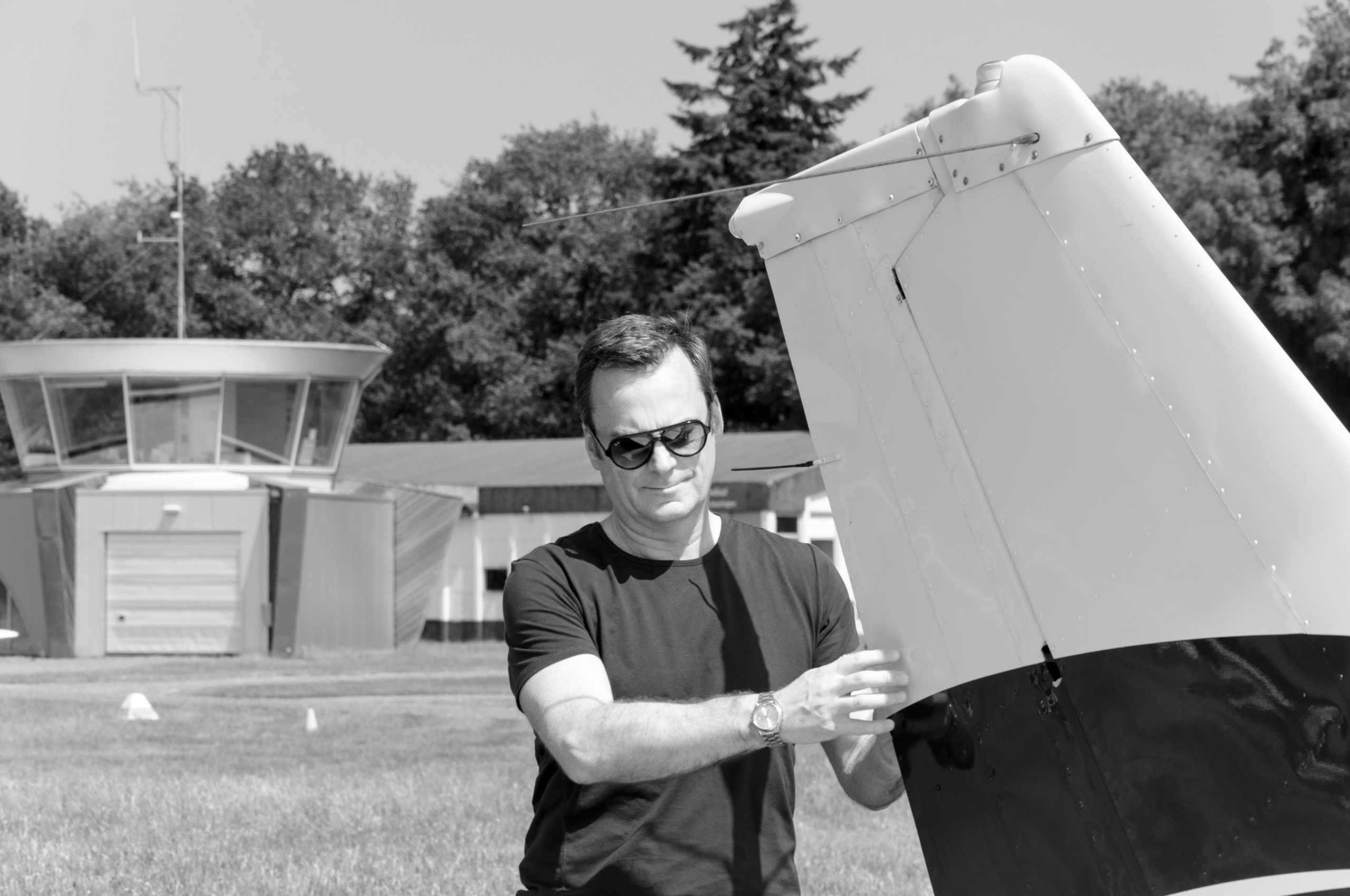 A photoshoot of a pilot and planes. Éclat Photos. Exclusive portrait photography service