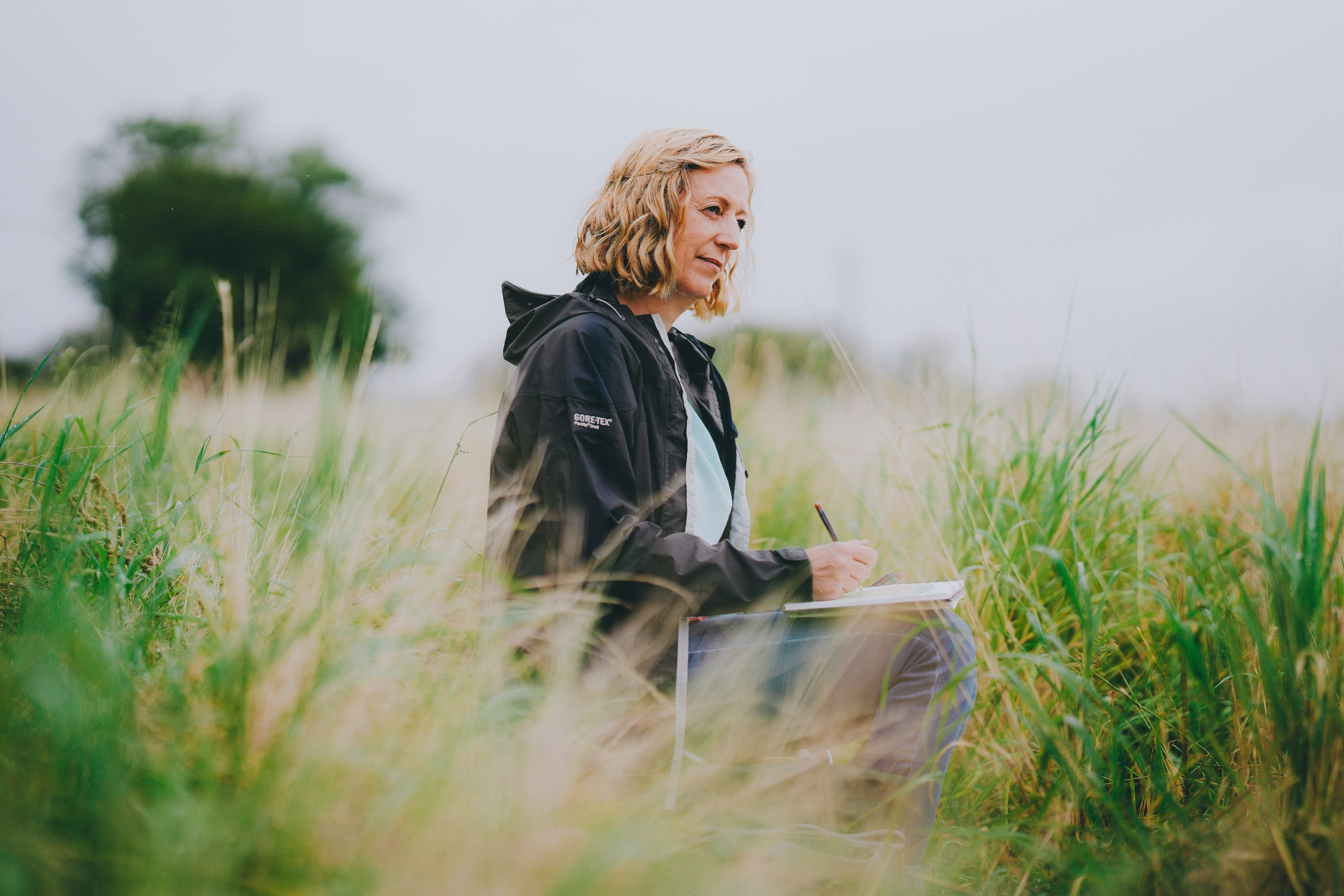 Brand photography. Artist paining in the fields