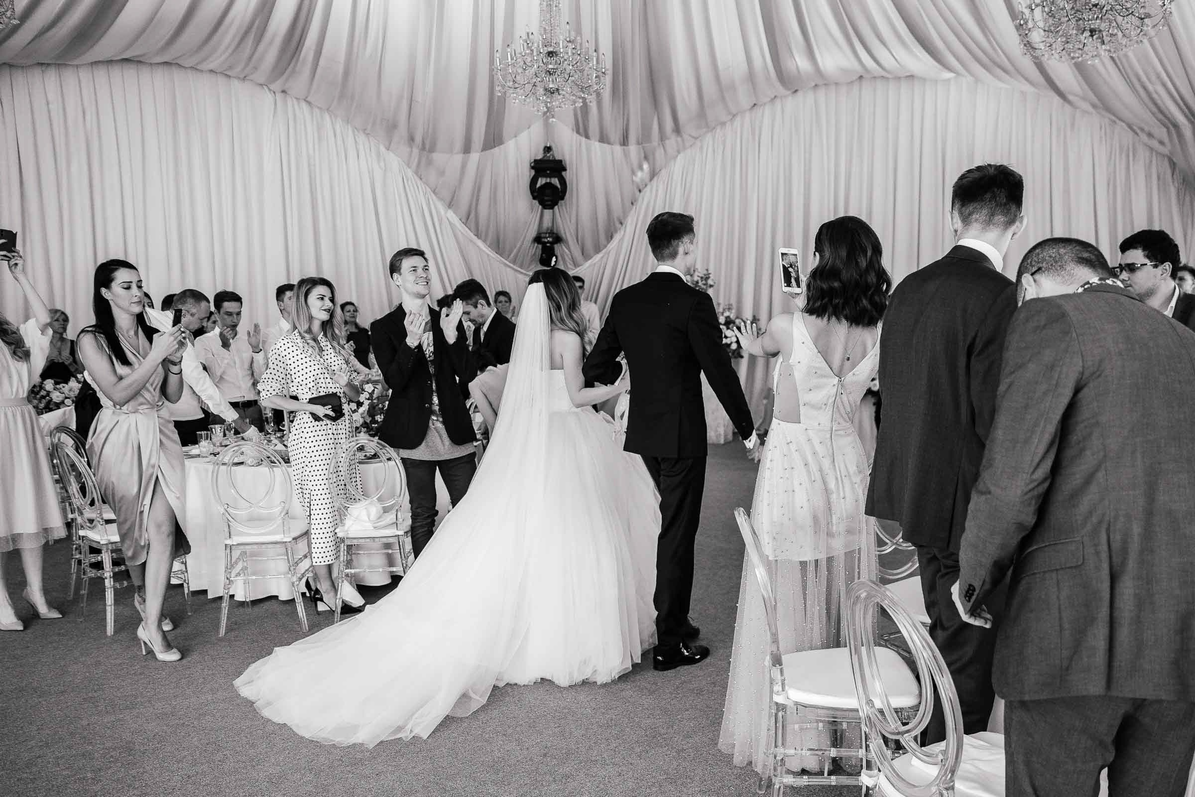 Couple’s reception entrance, by Tanya Bodgan, St Ives wedding photography.