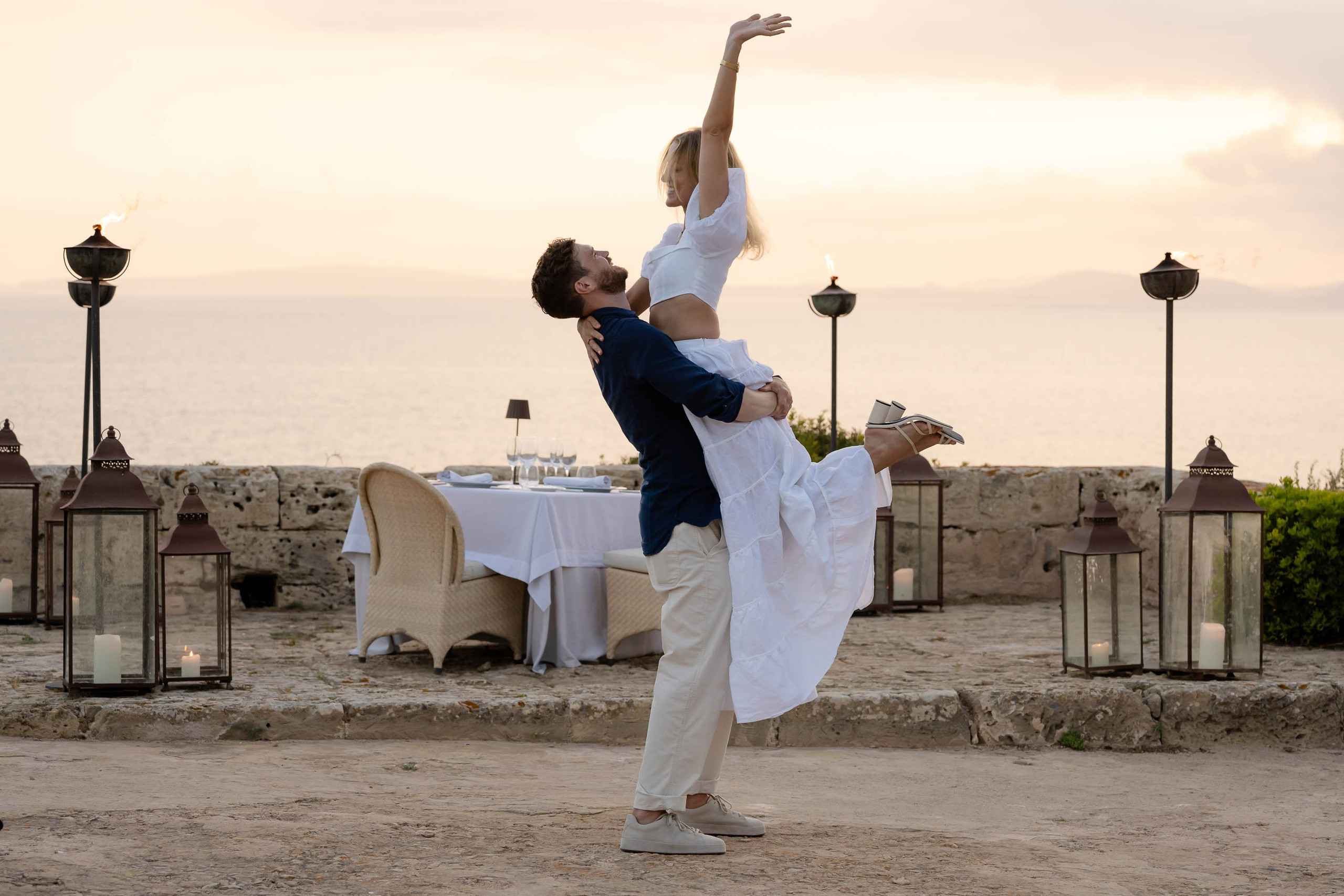 Hug and happiness between bride and groom at Cap Rocat Destination Wedding