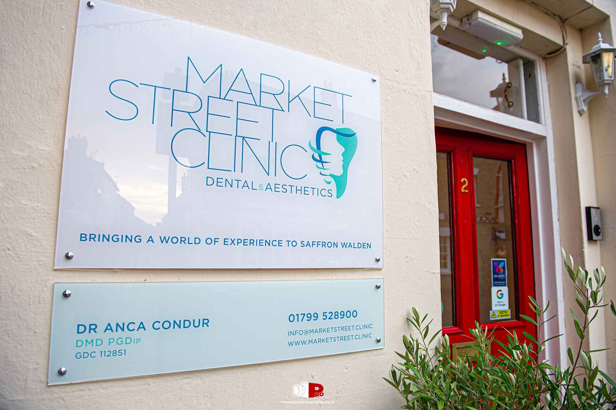 Market Street Dental Clinic exterior with contact information and branding.