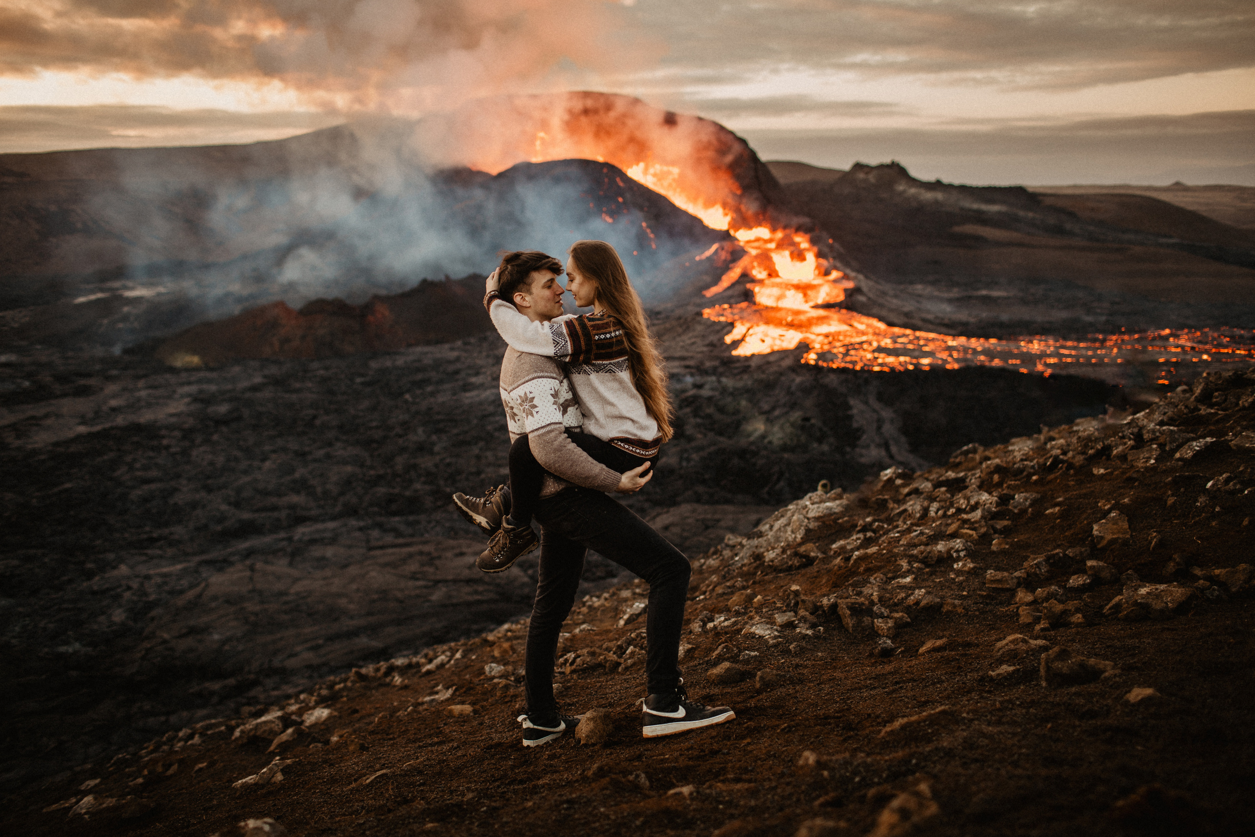 Couple photoshoot in front of volcano eruption in Iceland. Iceland elopement photo and video | Nikolaichik Photo