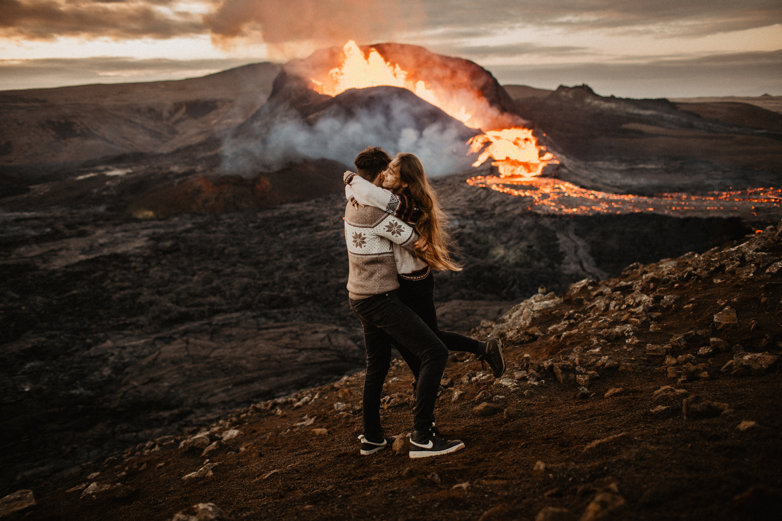 Couple photoshoot in front of volcano eruption in Iceland. Iceland elopement photo and video | Nikolaichik Photo