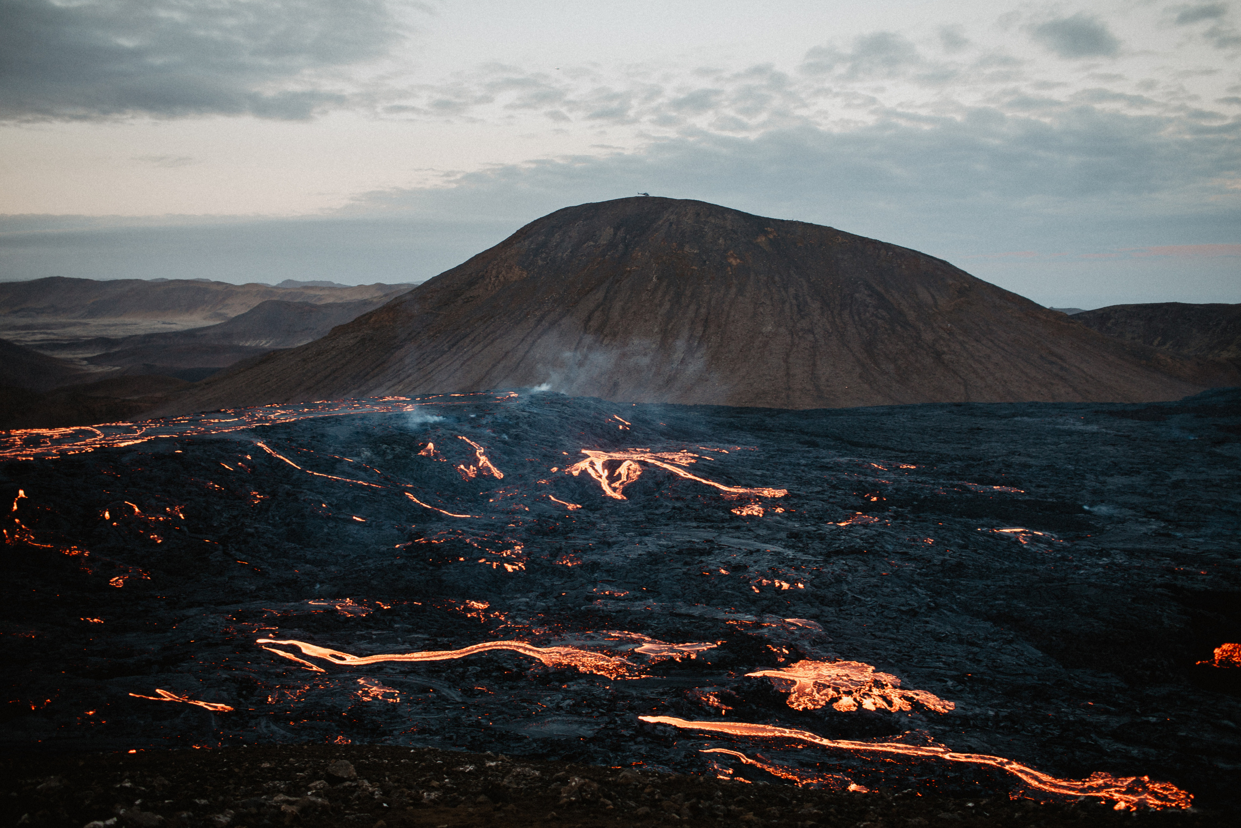 Couple photoshoot in front of volcano eruption in Iceland. Iceland elopement photo and video | Nikolaichik Photo