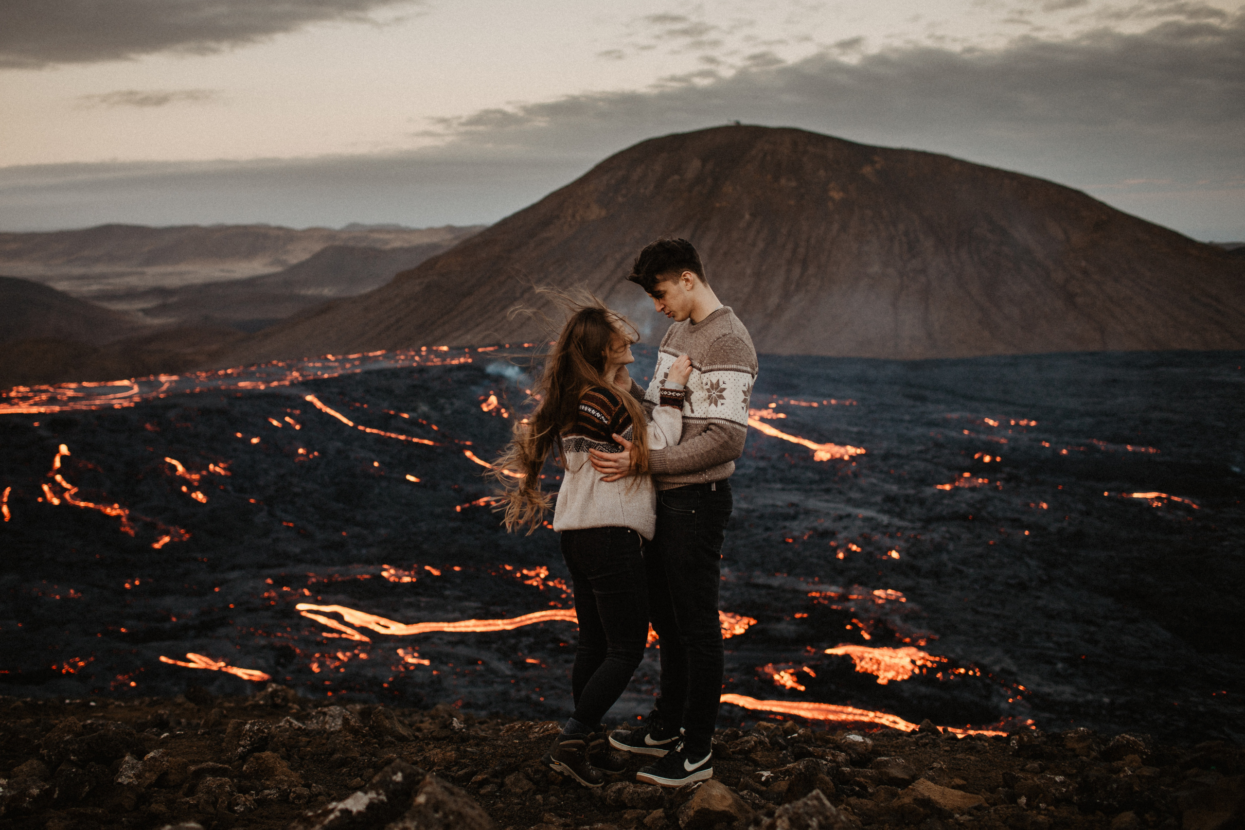 Couple photoshoot in front of volcano eruption in Iceland. Iceland elopement photo and video | Nikolaichik Photo