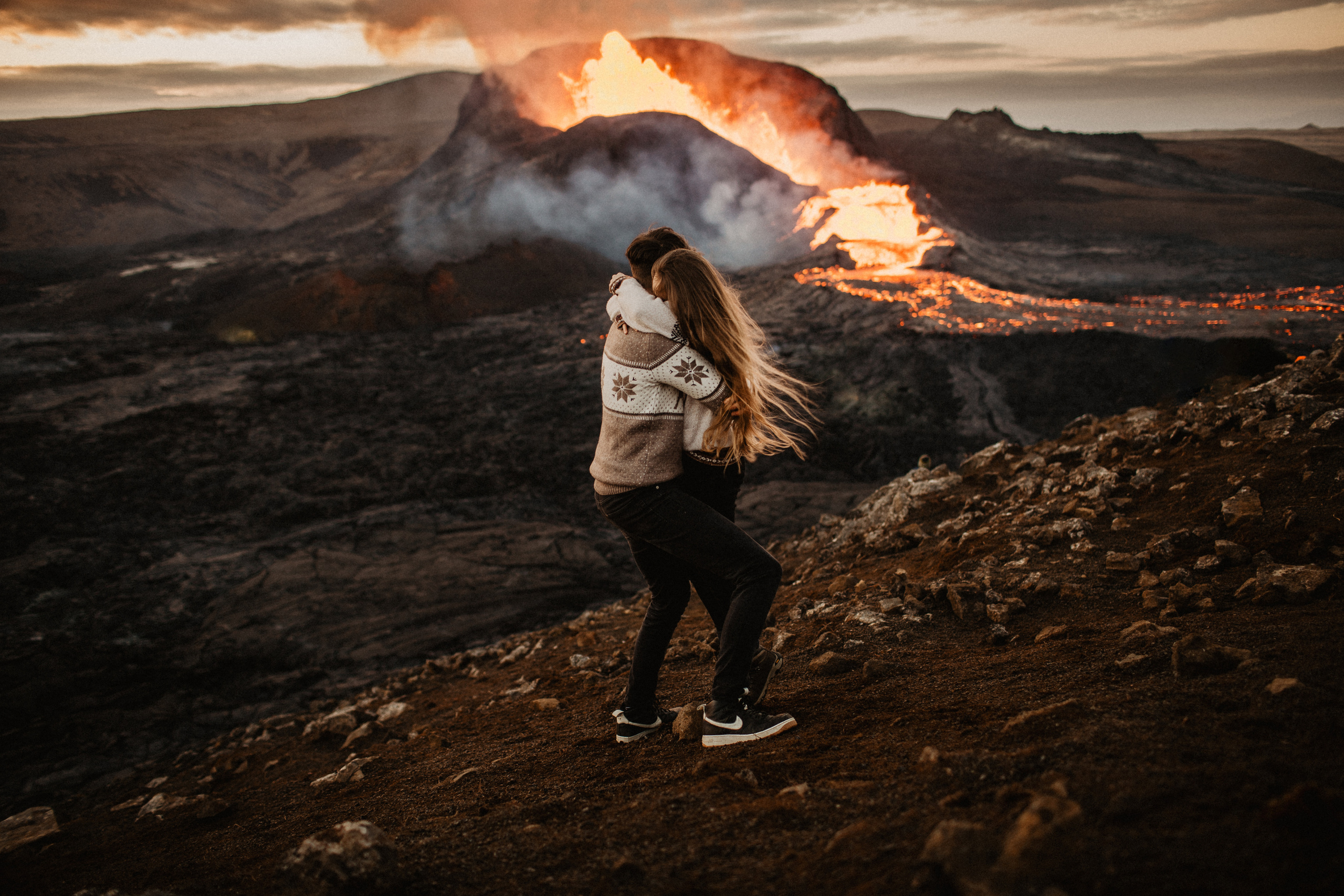 Couple photoshoot in front of volcano eruption in Iceland. Iceland elopement photo and video | Nikolaichik Photo