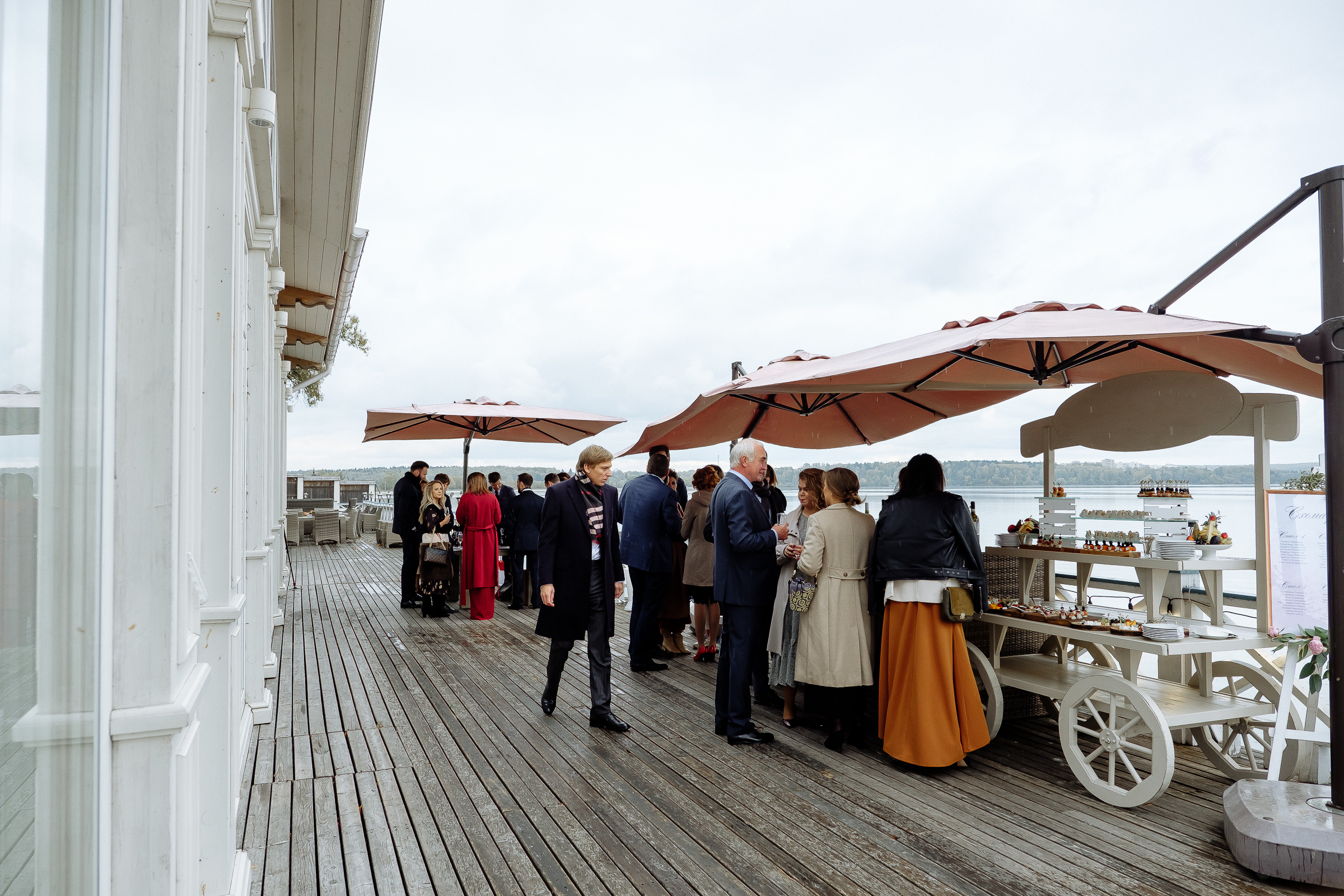 Guests boarding riverboat, by Tanya Bodgan, Bude, Cornwall wedding photographer.  