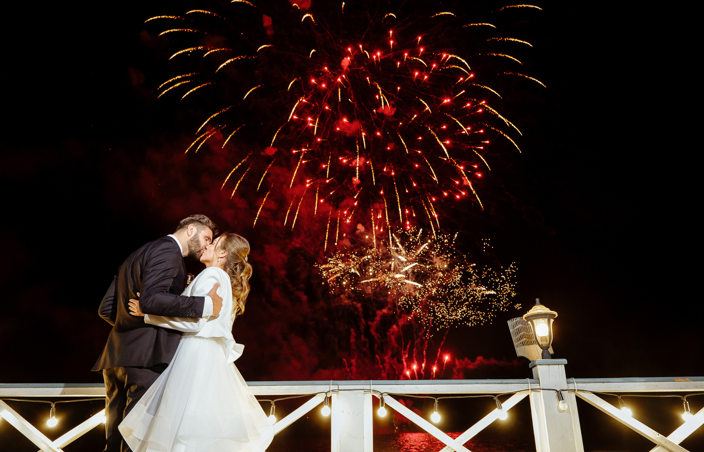 Bride and groom under fireworks, by Tanya Bodgan, Bude, Cornwall wedding photographer.
