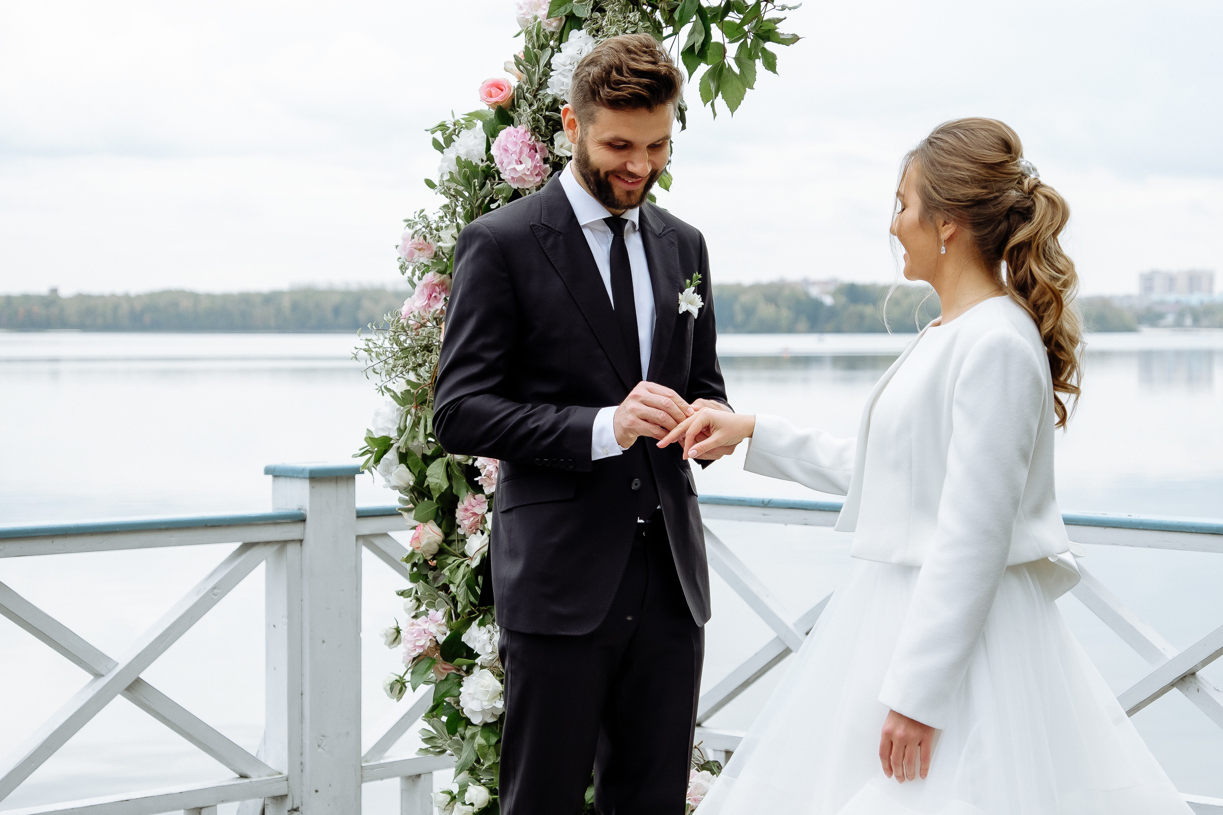 Ring exchange by riverside, by Tanya Bodgan, Bude wedding photography.