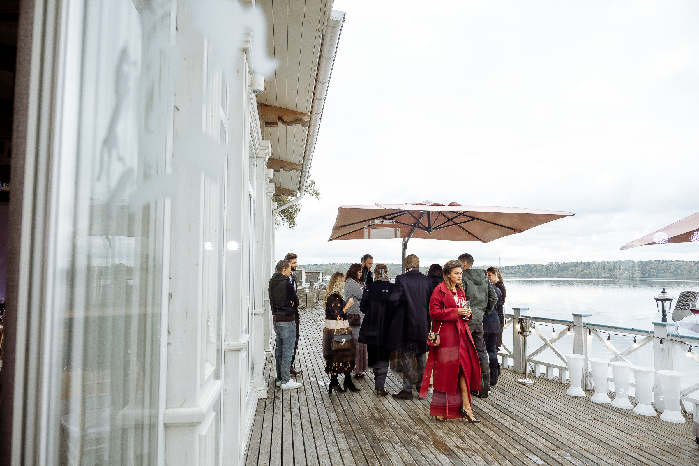 Guests enjoying riverboat views, by Tanya Bodgan, Newquay wedding photography.  