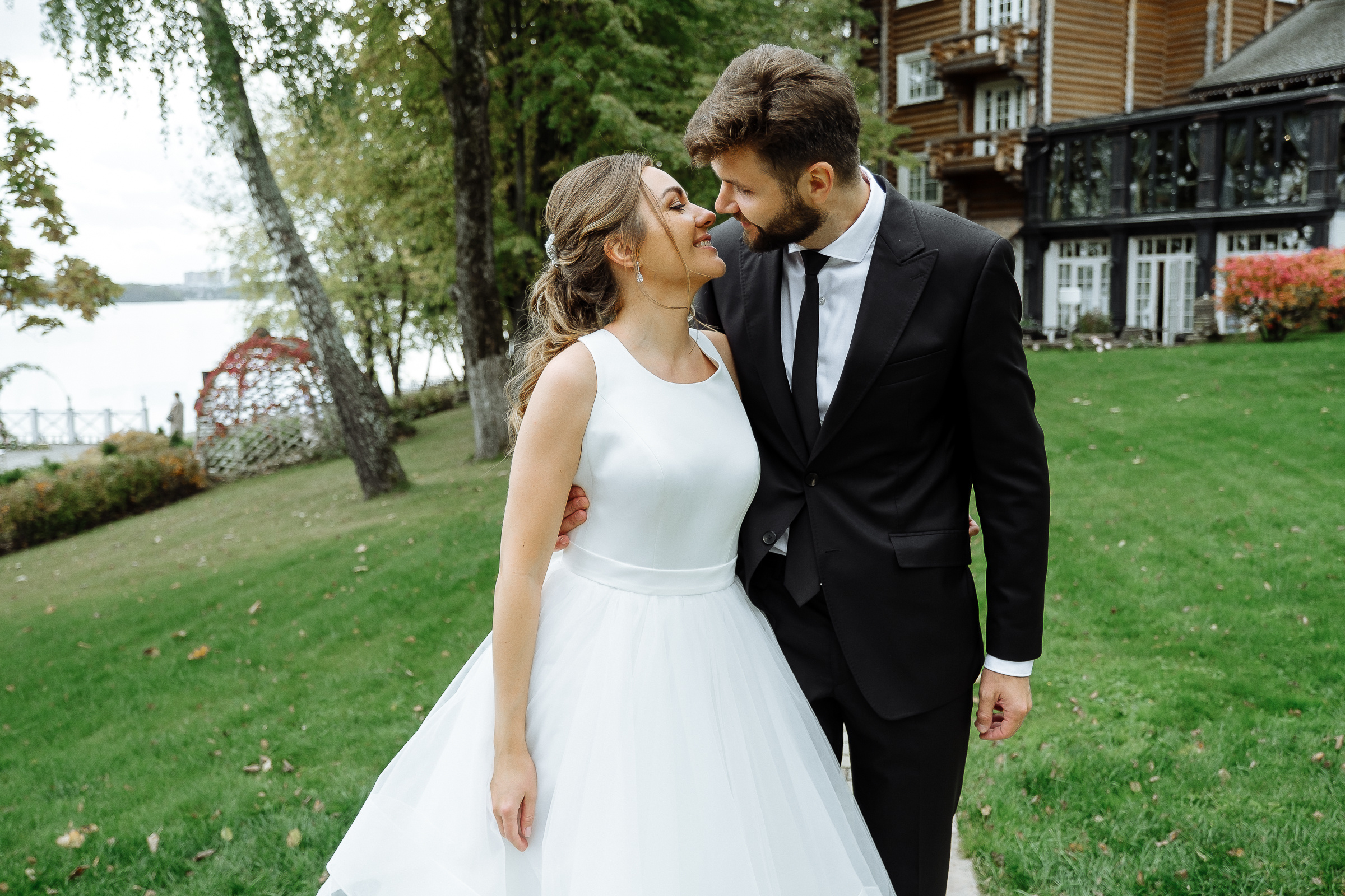 Bride and groom morning walk in garden, by Tanya Bodgan, Bude, wedding photographer.