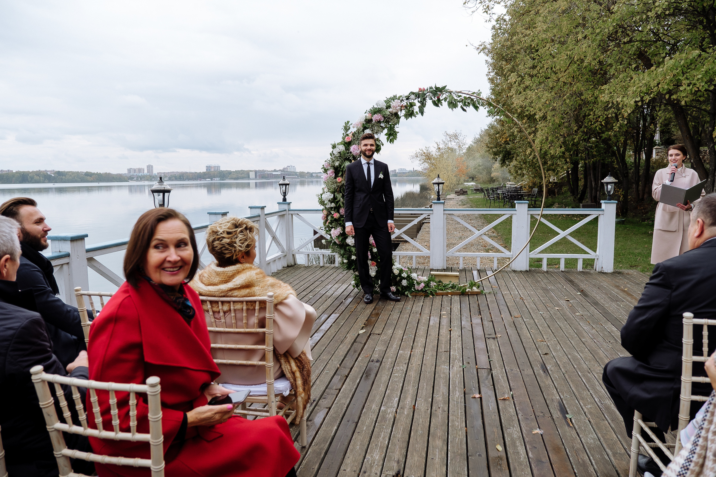 Groom waiting at ceremony on riverboat deck, by Tanya Bodgan, Bude, Cornwall wedding photographer.  