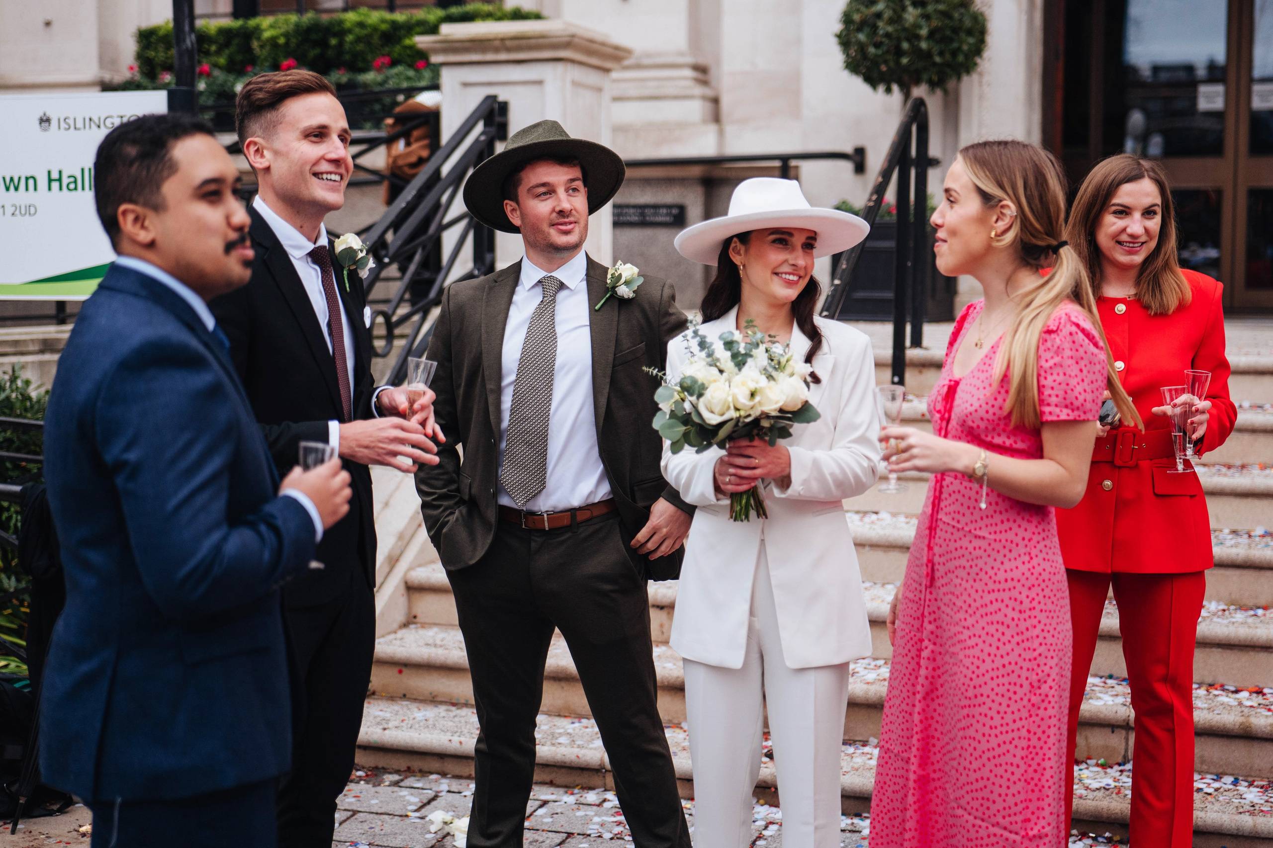 Exit from Islington town hall, champagne bottle opening 