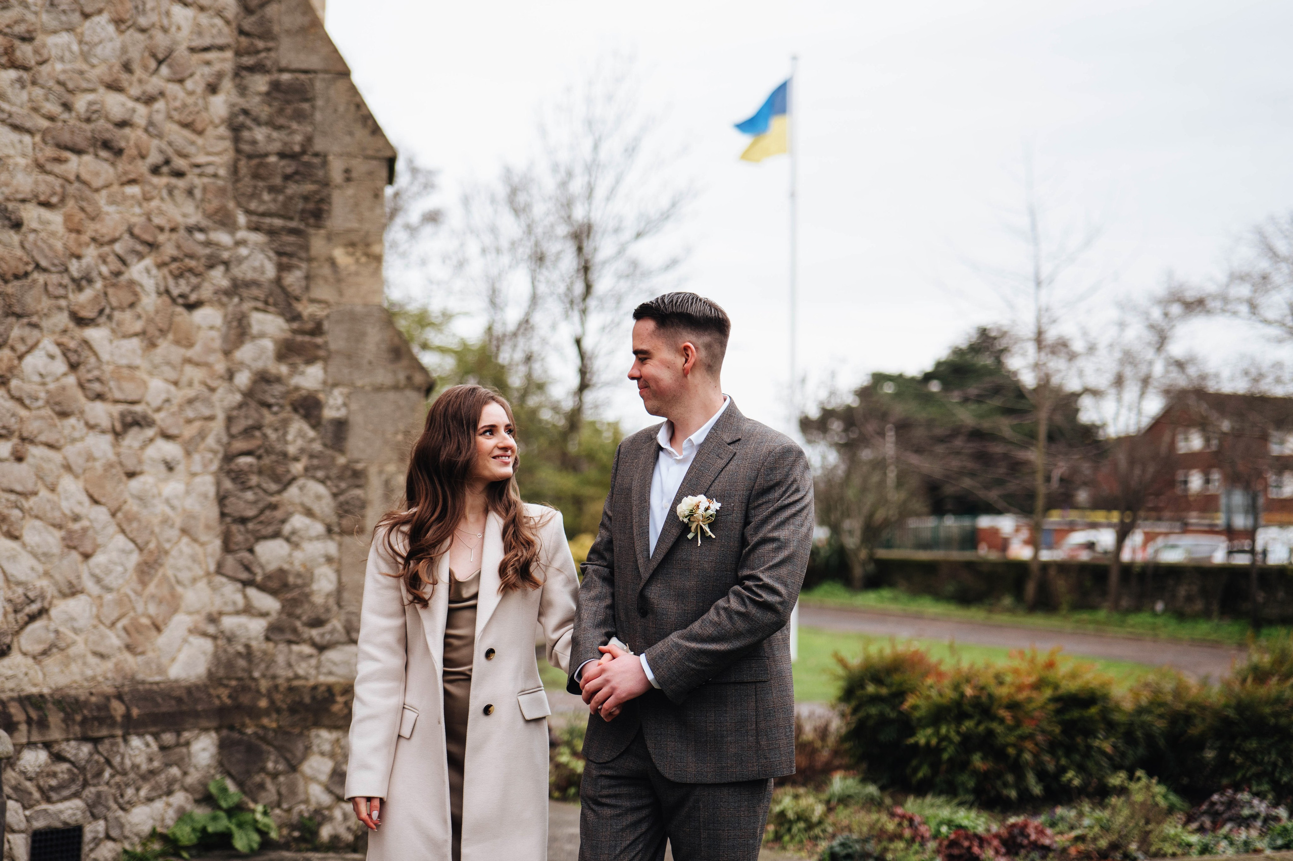 friends of bride and groom with ukrainian flag on the background